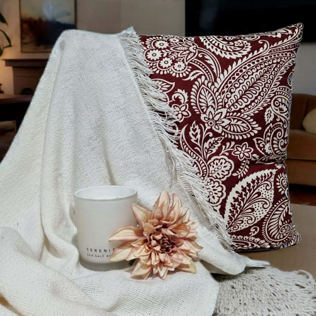 Retro-style red paisley cushion cover –  mid-century modern space.
