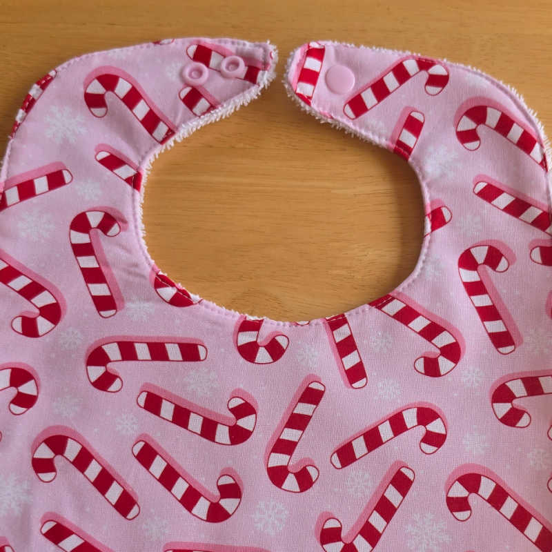 Handmade Christmas Baby Bib – Candy Canes on Pink