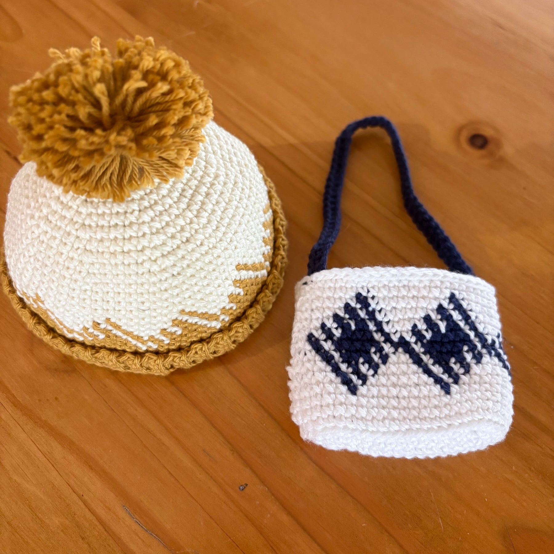 Crochet doll in overalls and beanie.