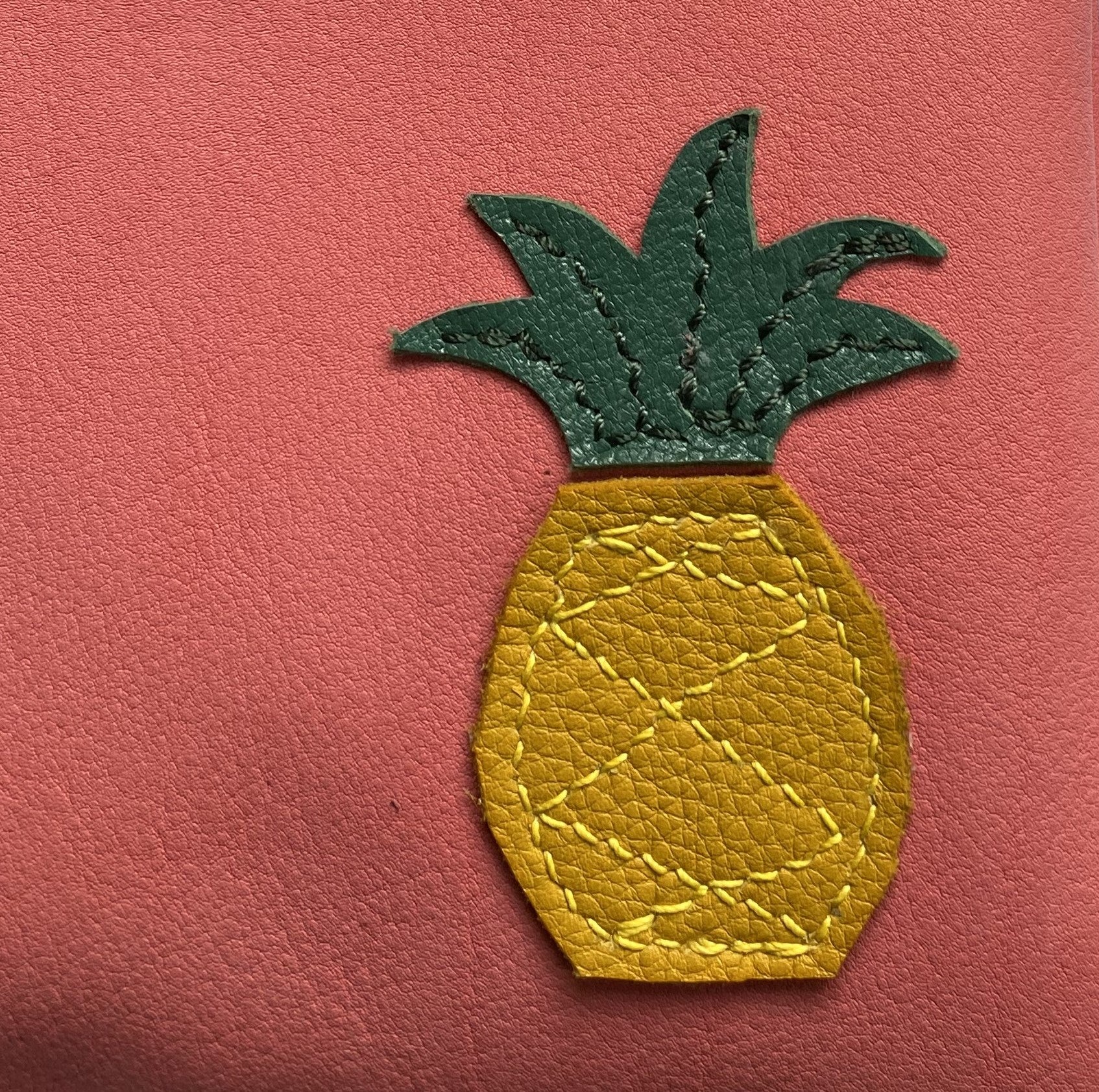 Leather crossbody bag with pineapple motif