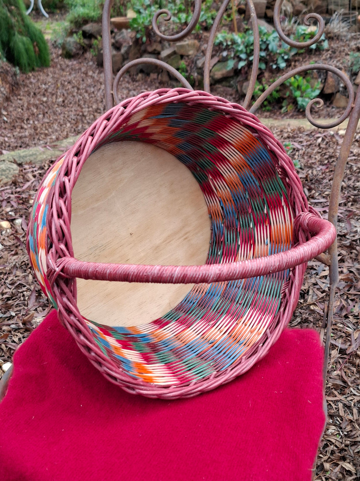 Large Round Market Basket brown, blue, orange, red and natural. Handle brown.