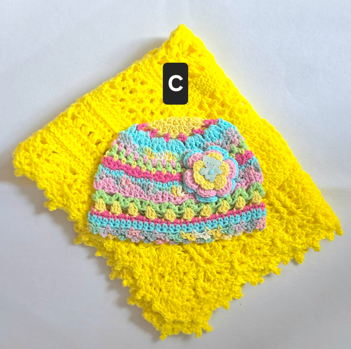 Crocheted Baby Hat with Flower Detail