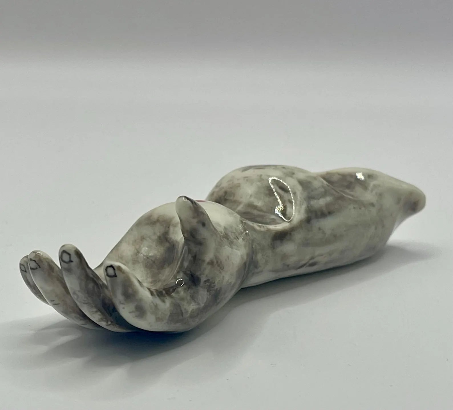 Handmade porcelain ‘helping hand’ brush rest