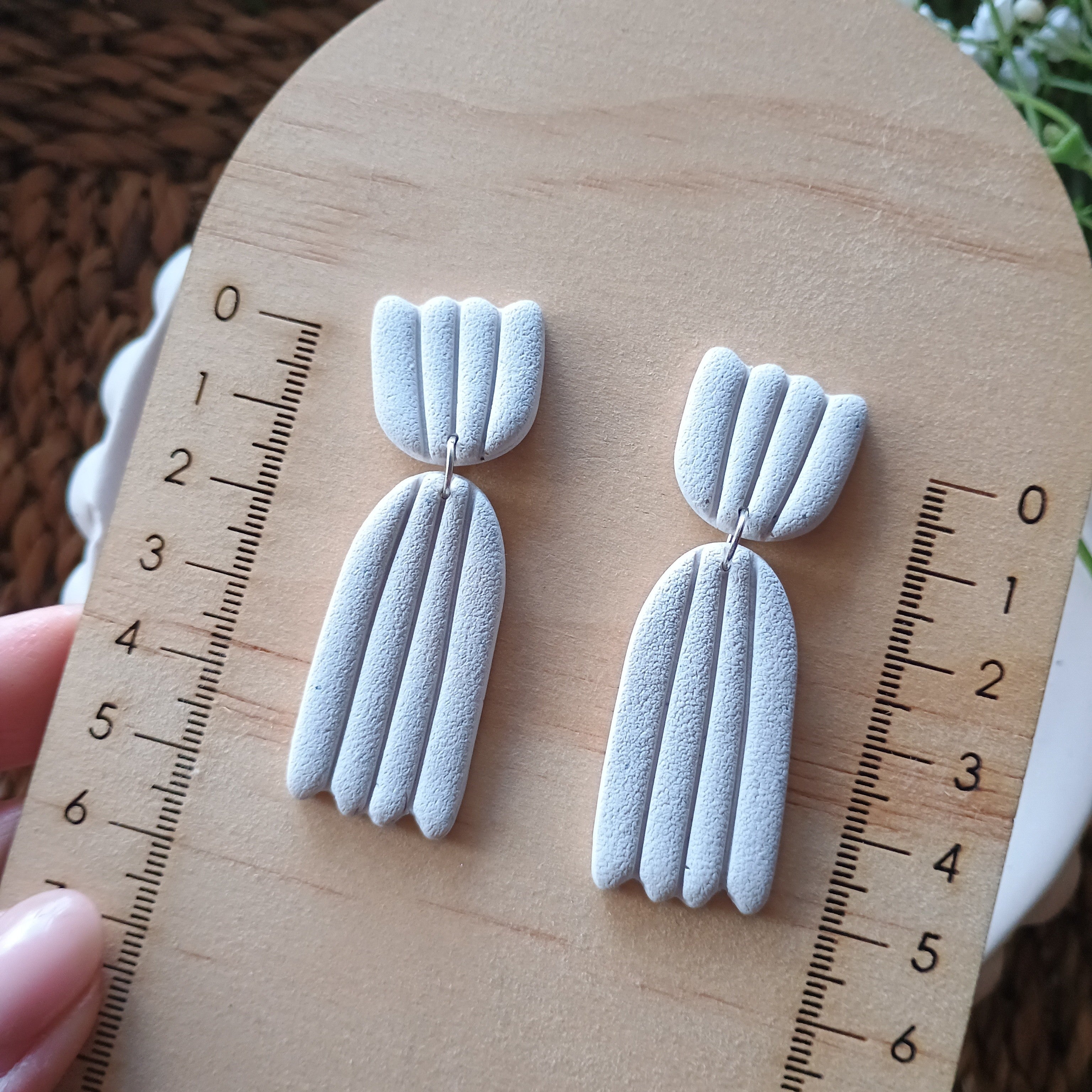 Embossed petal dangle earrings