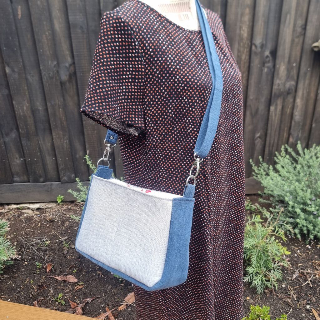 Handmade appliqued crossbody zip bag - blue with flannel flowers