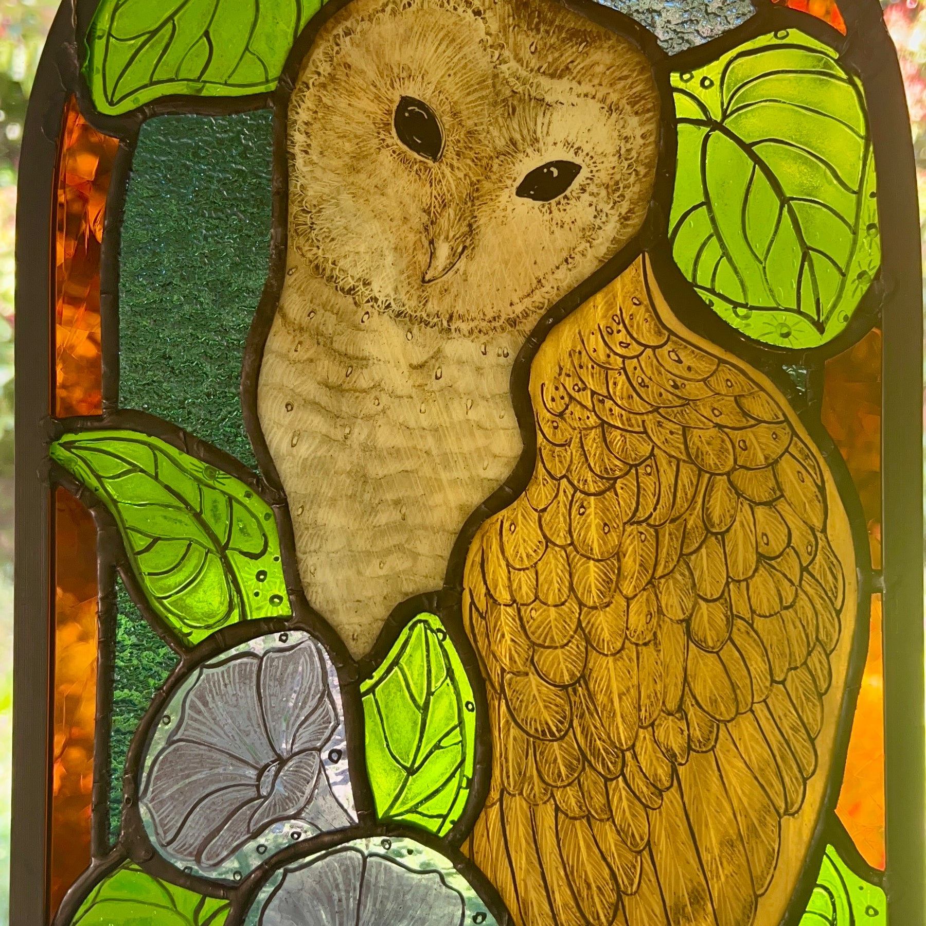 Stained glass owl panel.