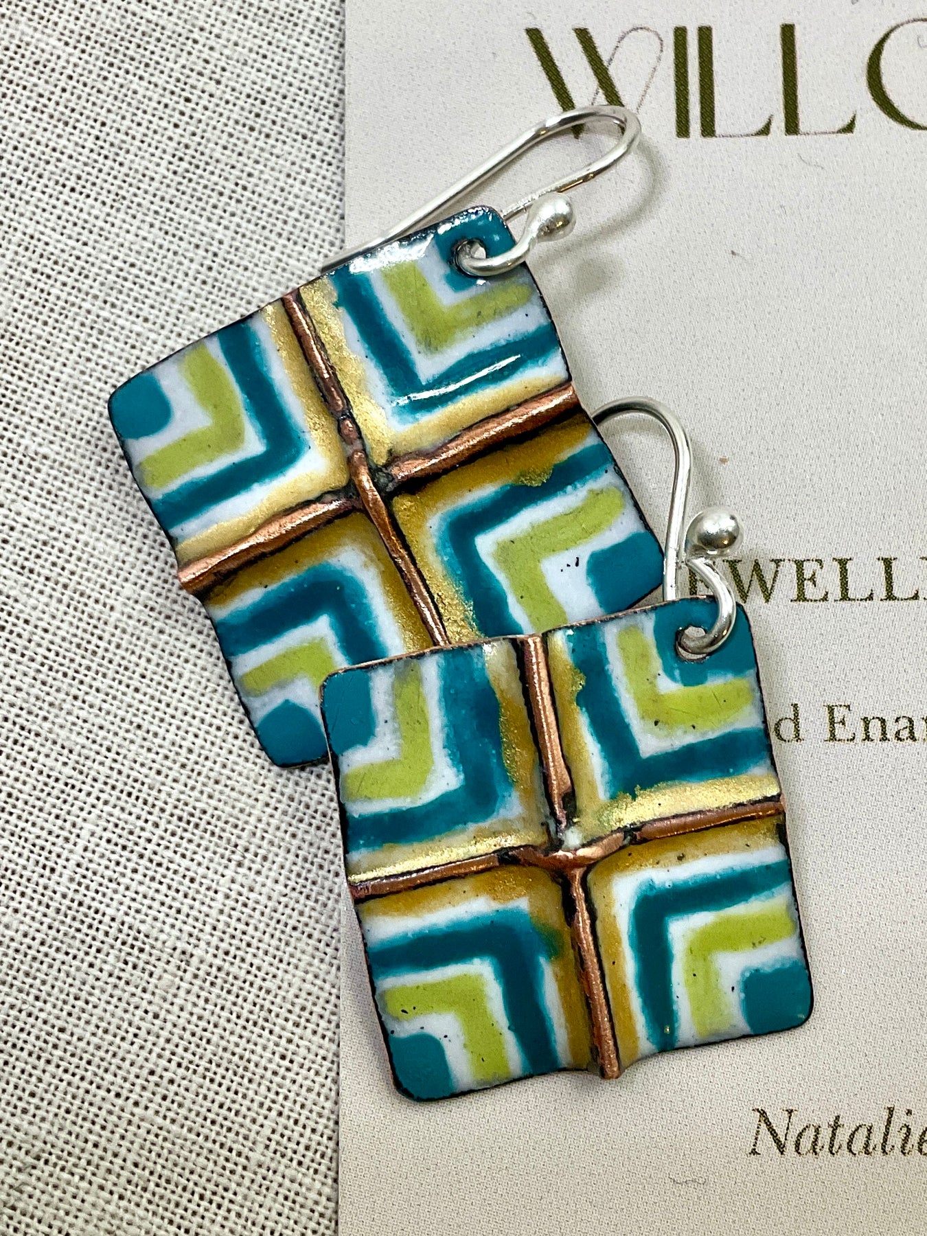 White, gold, teal and green fold form enamel earrings. Handmade