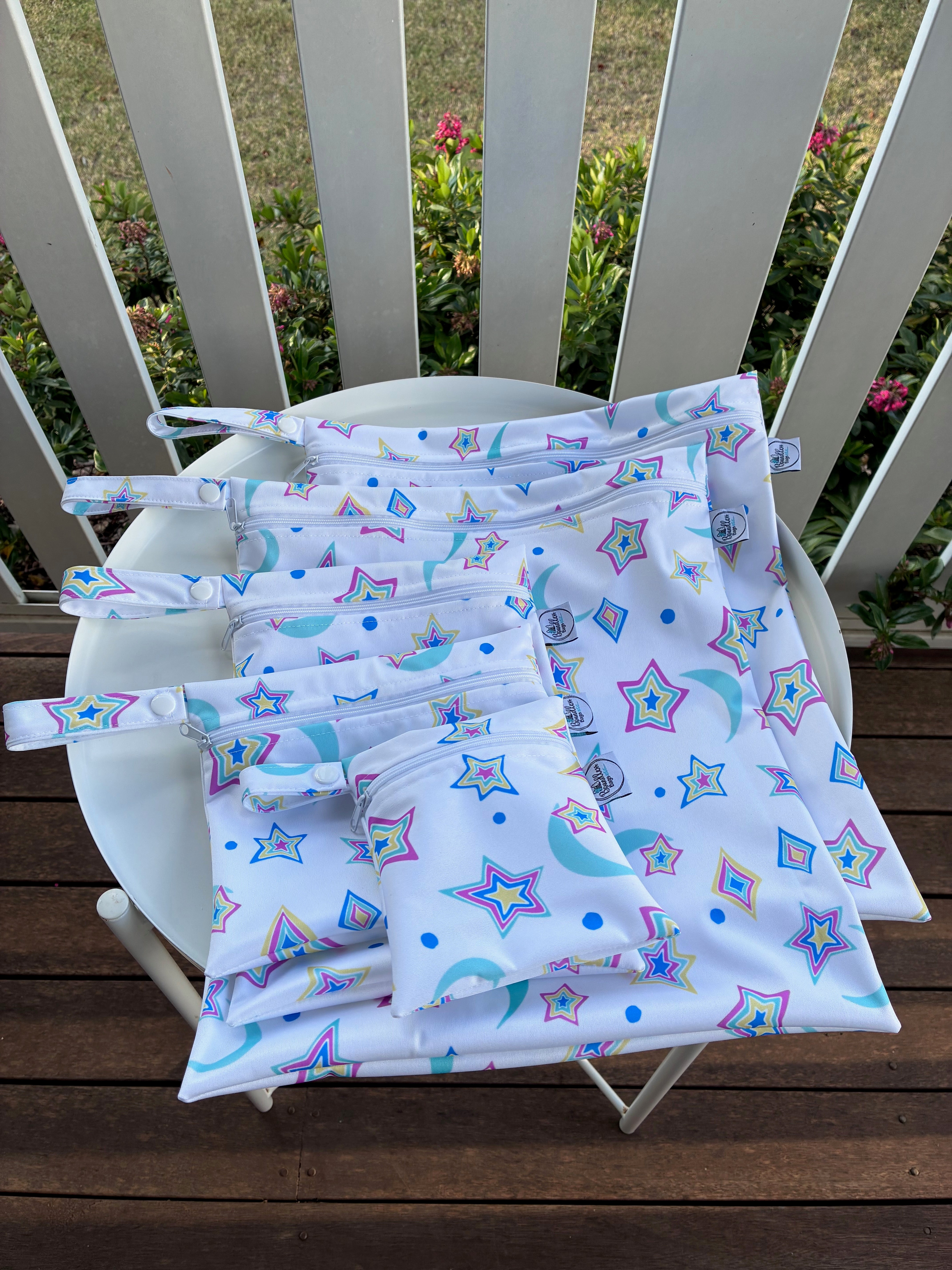READY MADE Water-resistant wet bags - Psychedelic Retro Stars and Moons Rainbow on White (JacSlade)