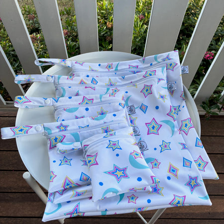 READY MADE Water-resistant wet bags - Psychedelic Retro Stars and Moons Rainbow on White (JacSlade)