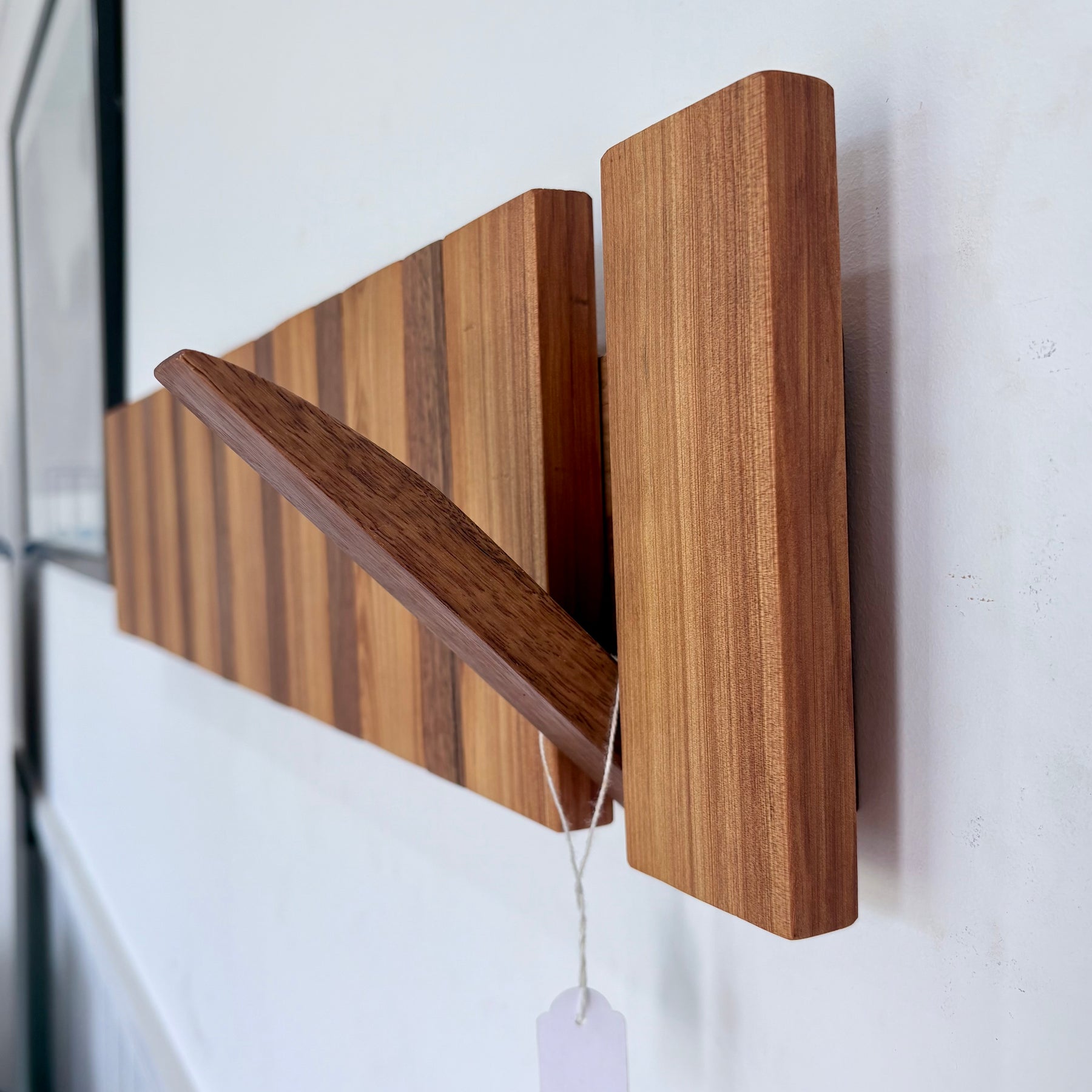 Two tone spotted gum and cypress horizon line piano style coatrack