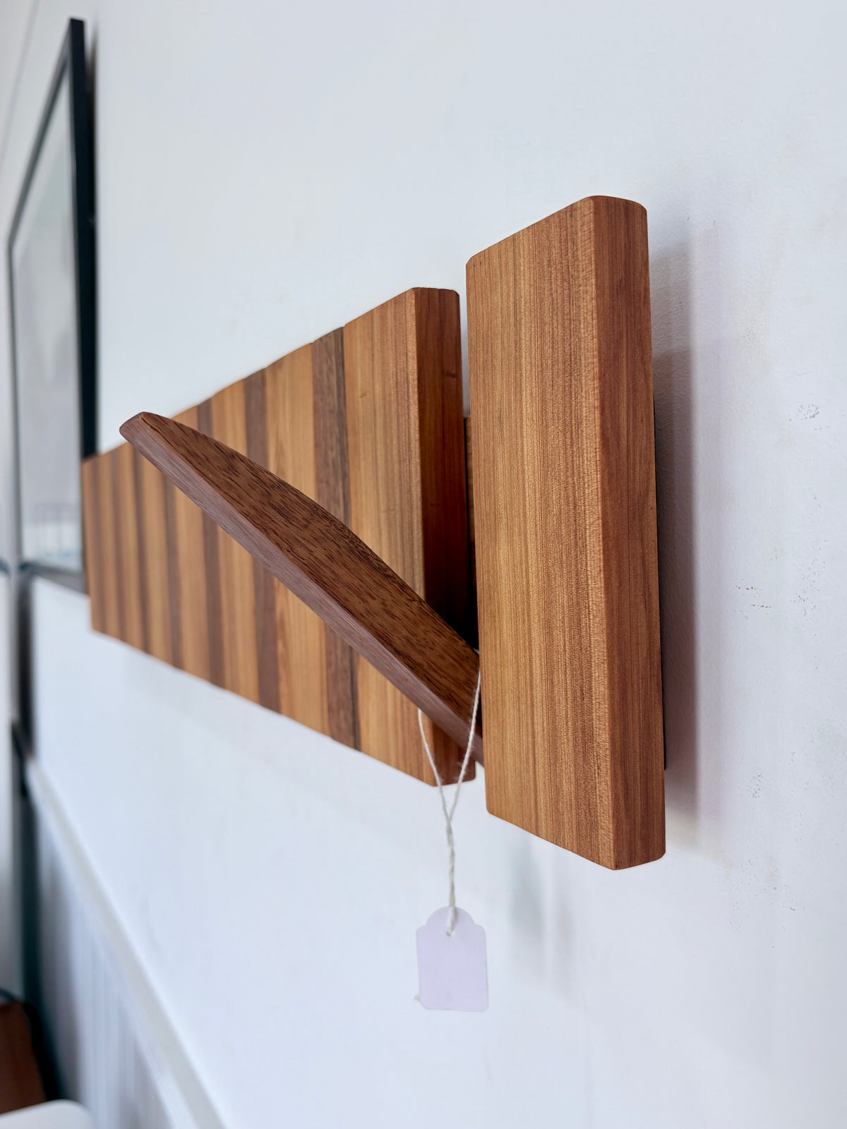 Two tone spotted gum and cypress horizon line piano style coatrack
