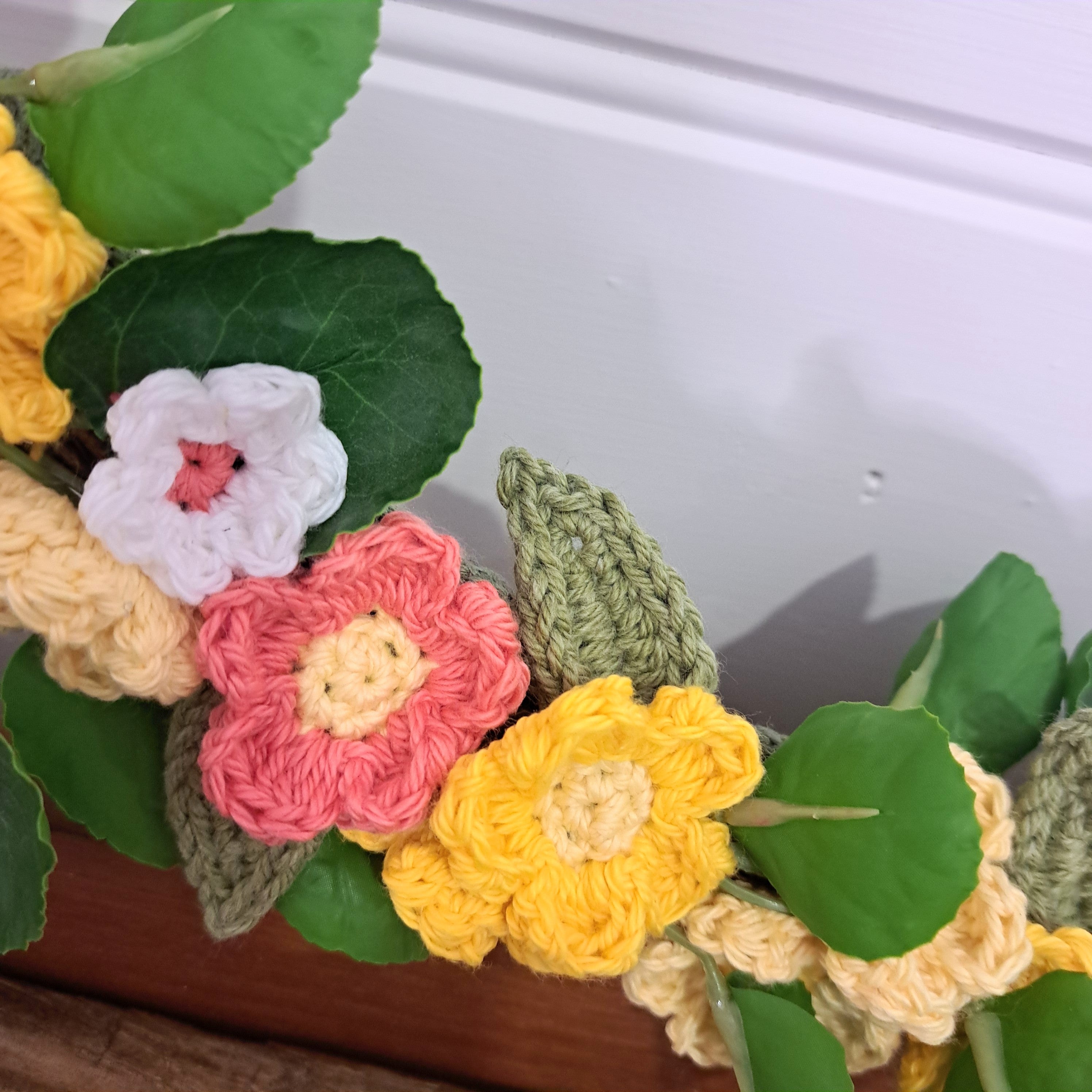 Handmade crochet spring flower wreath, yellows, pinks, white