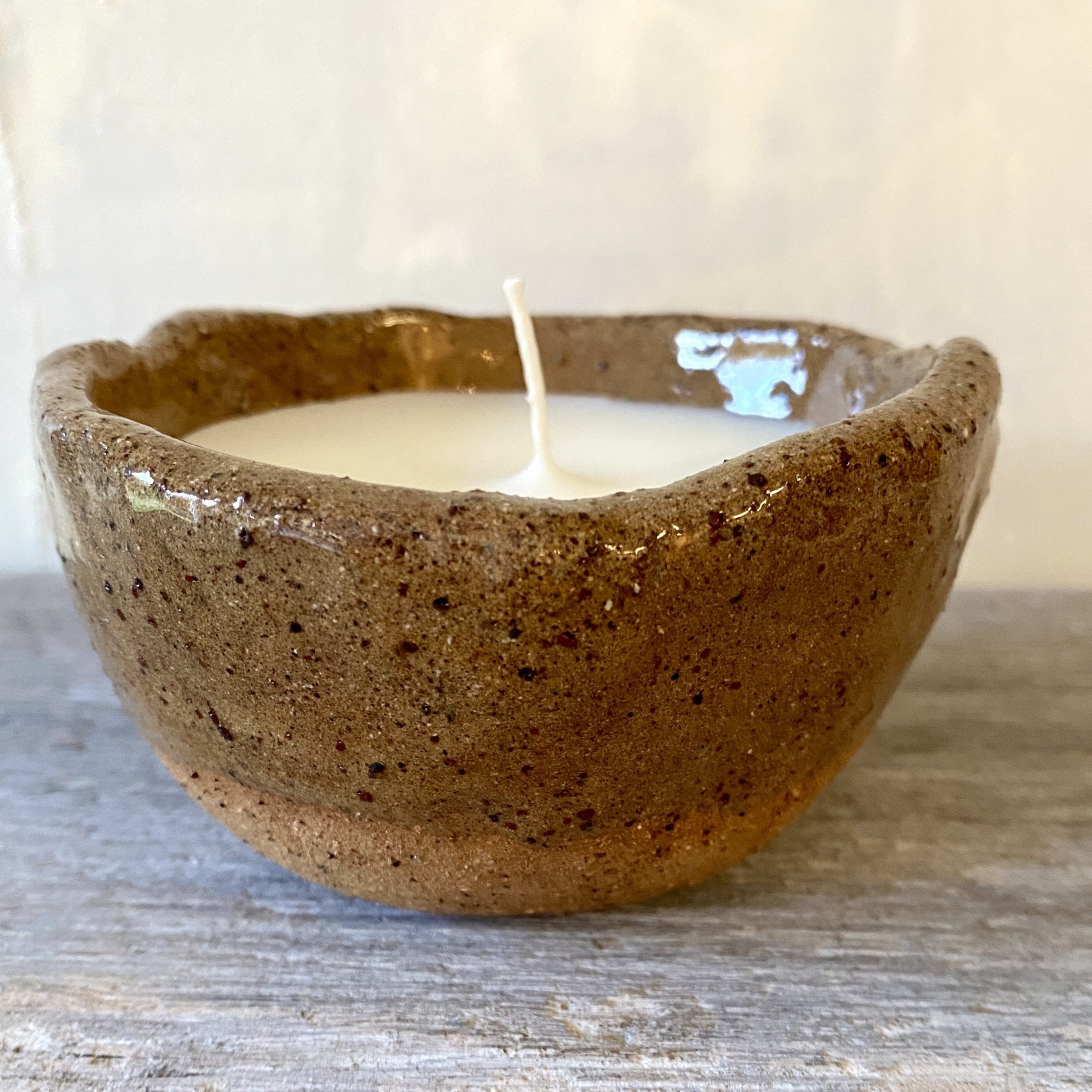 Soy candle in rustic clear glazed speckled ceramic bowl