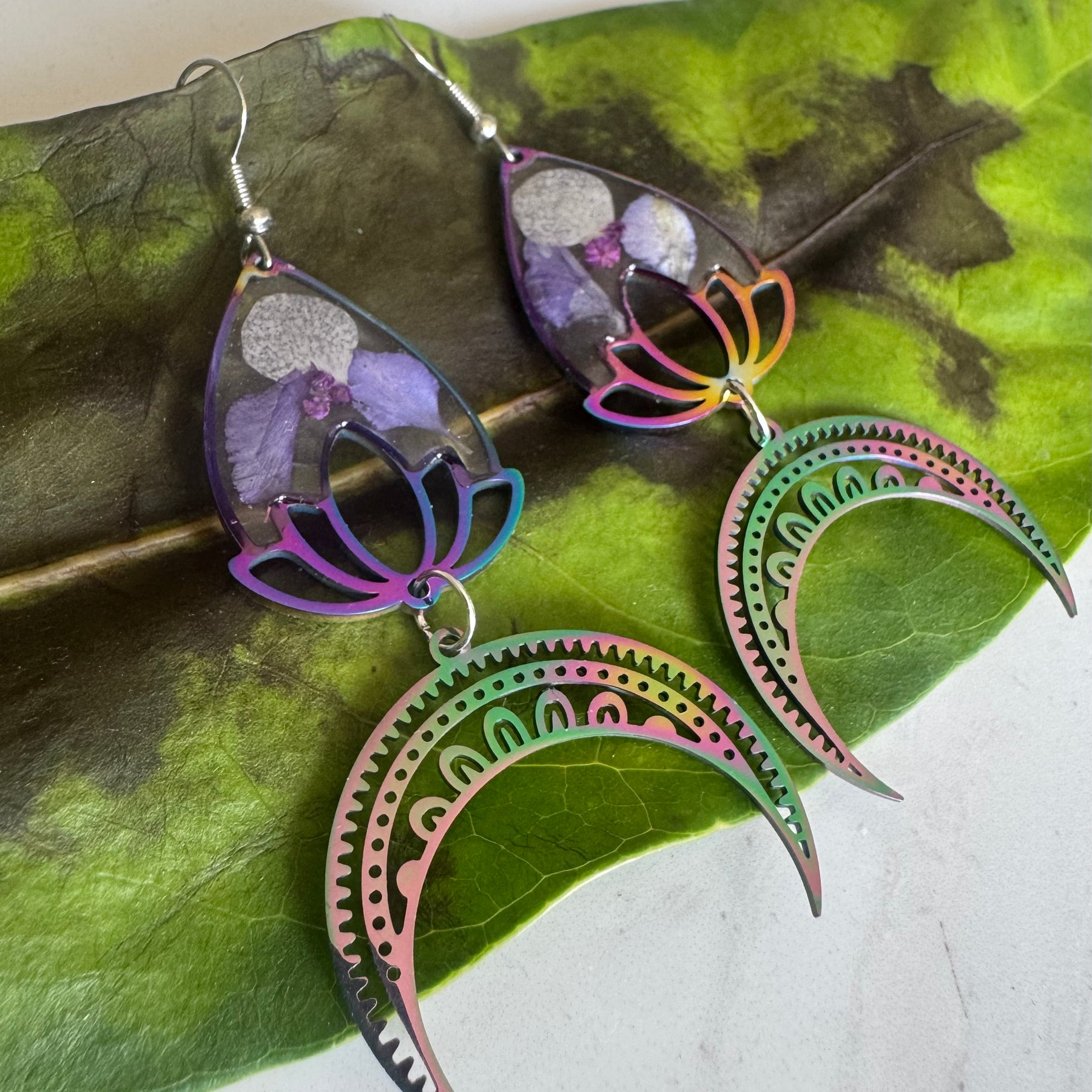 Iridescent rainbow resin earrings with pressed flowers