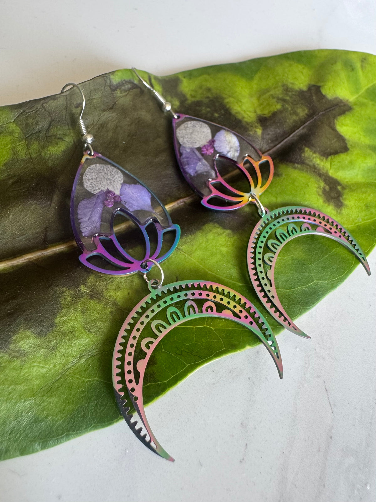 Iridescent rainbow resin earrings with pressed flowers