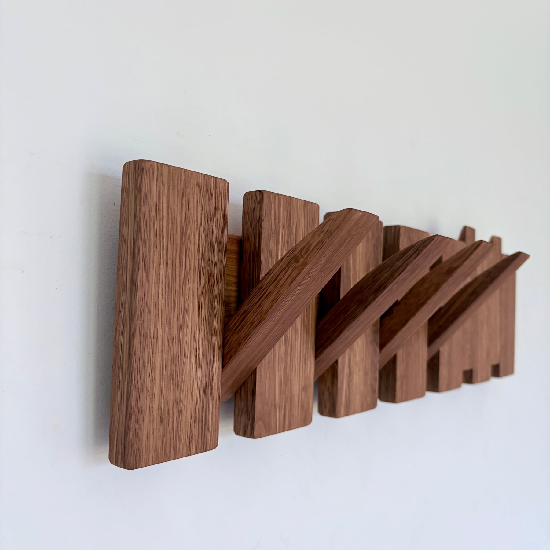 Grey box piano style coat rack