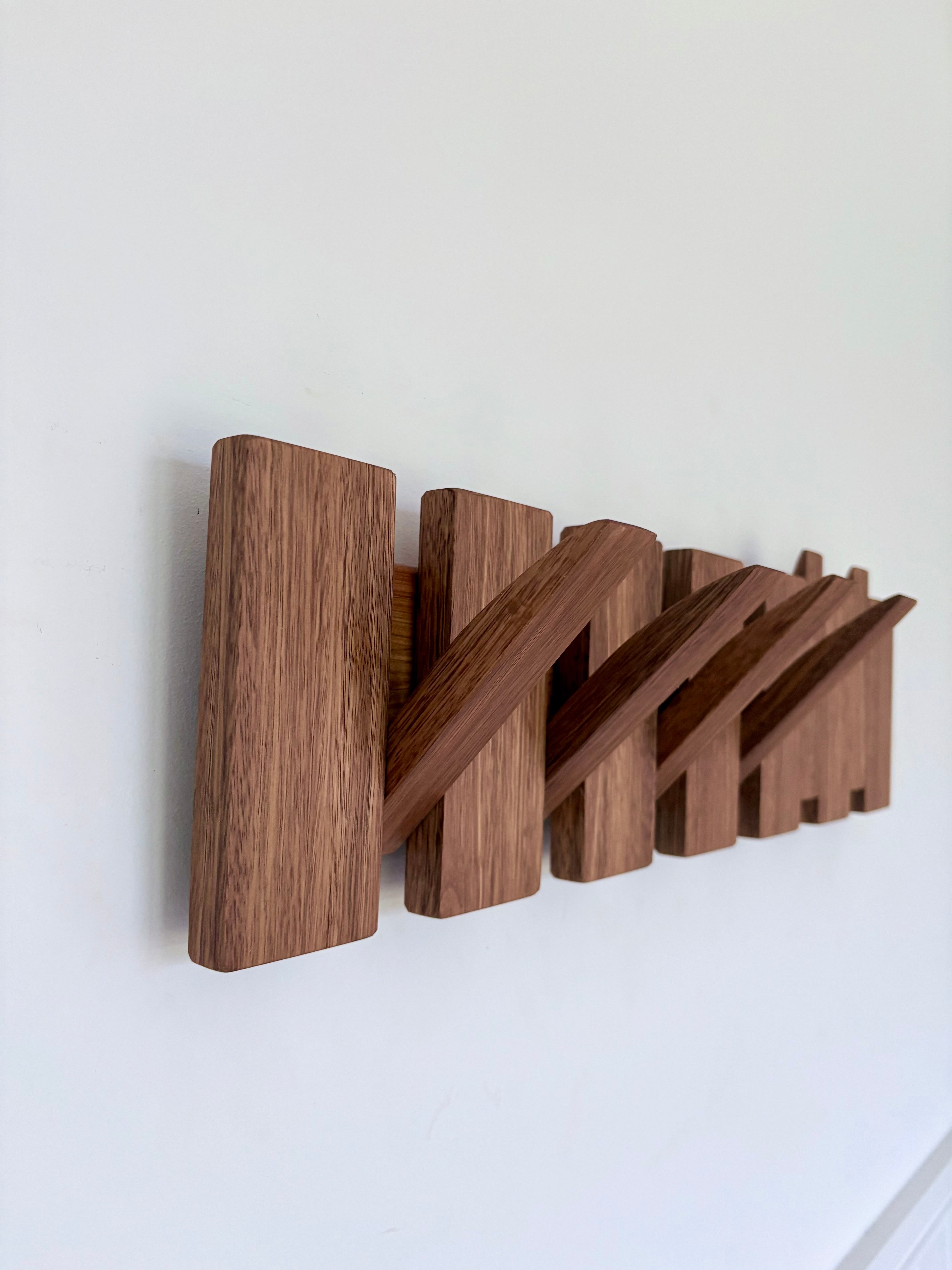 Grey box piano style coat rack
