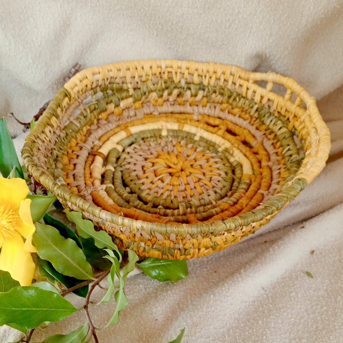 Small ornamental basket in saffron and green