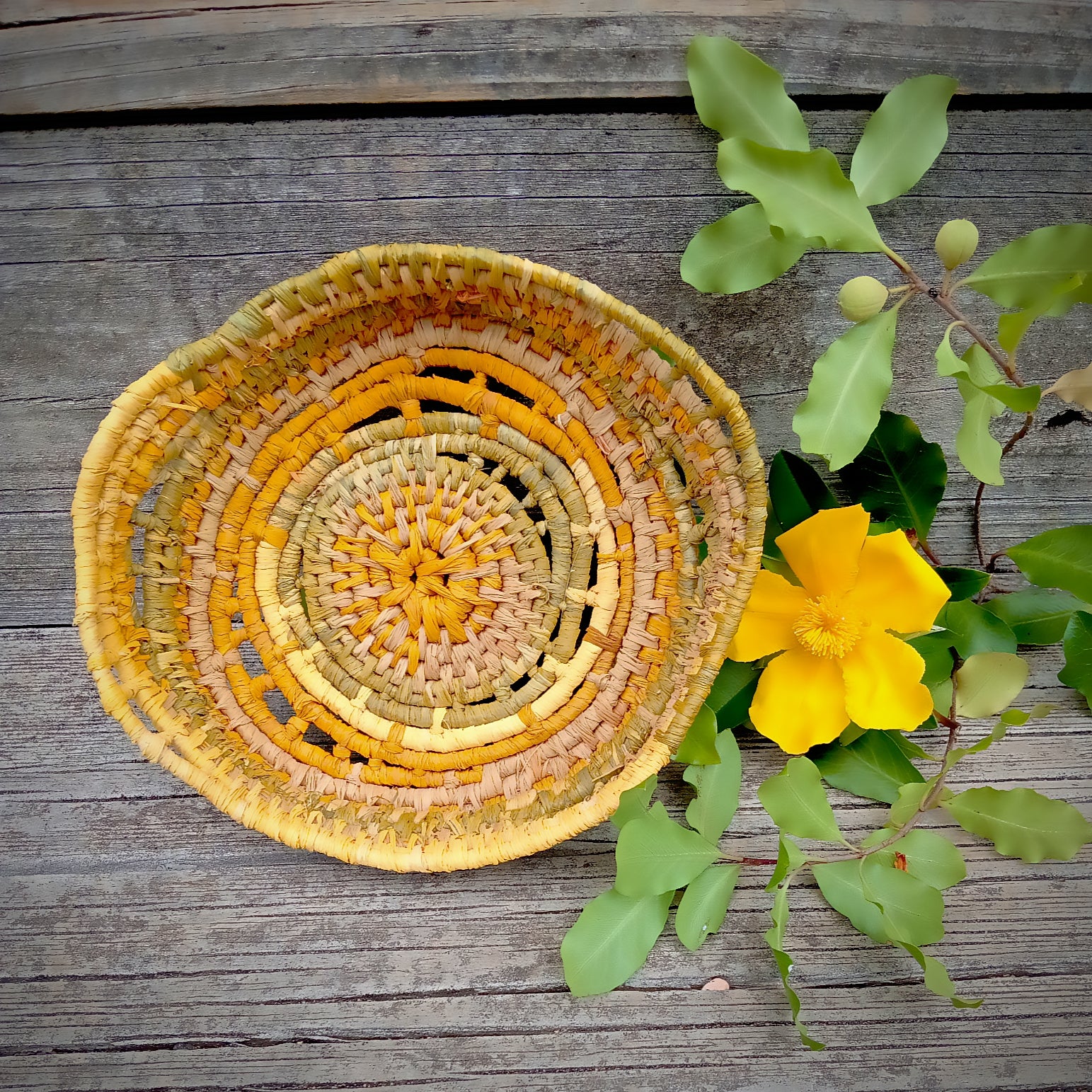 Small ornamental basket in saffron and green