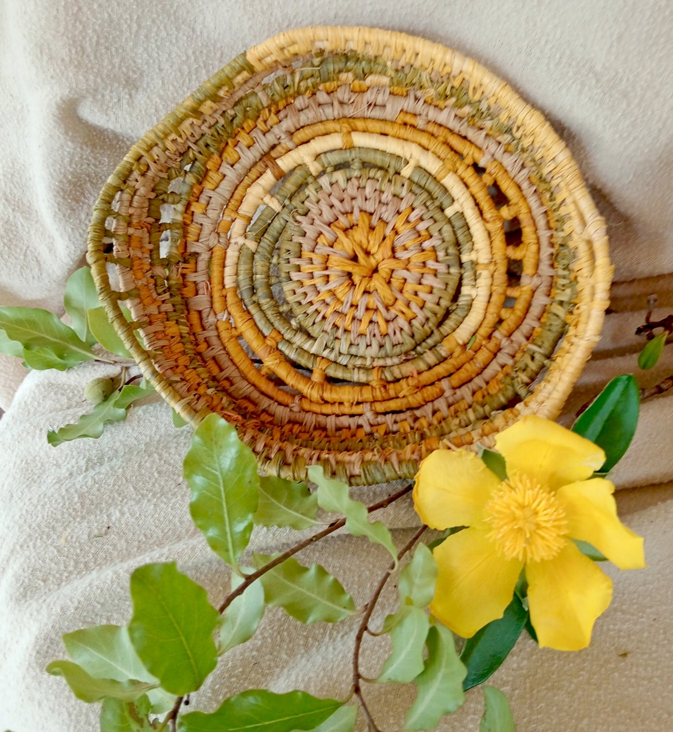 Small ornamental basket in saffron and green