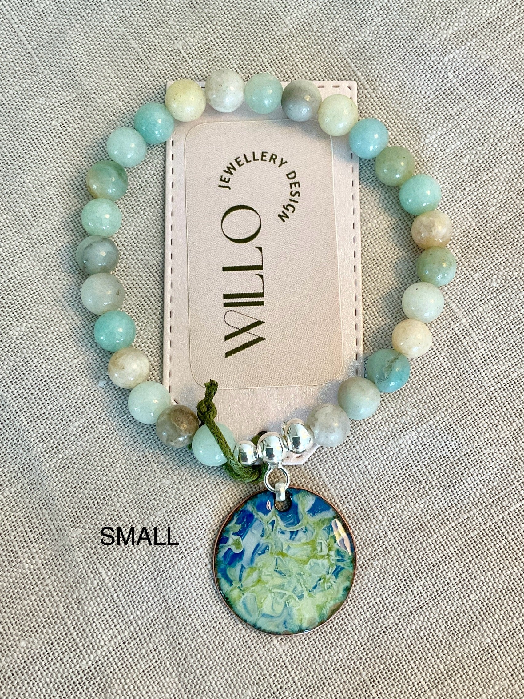 Amazonite gemstone bracelet with enamel charm.