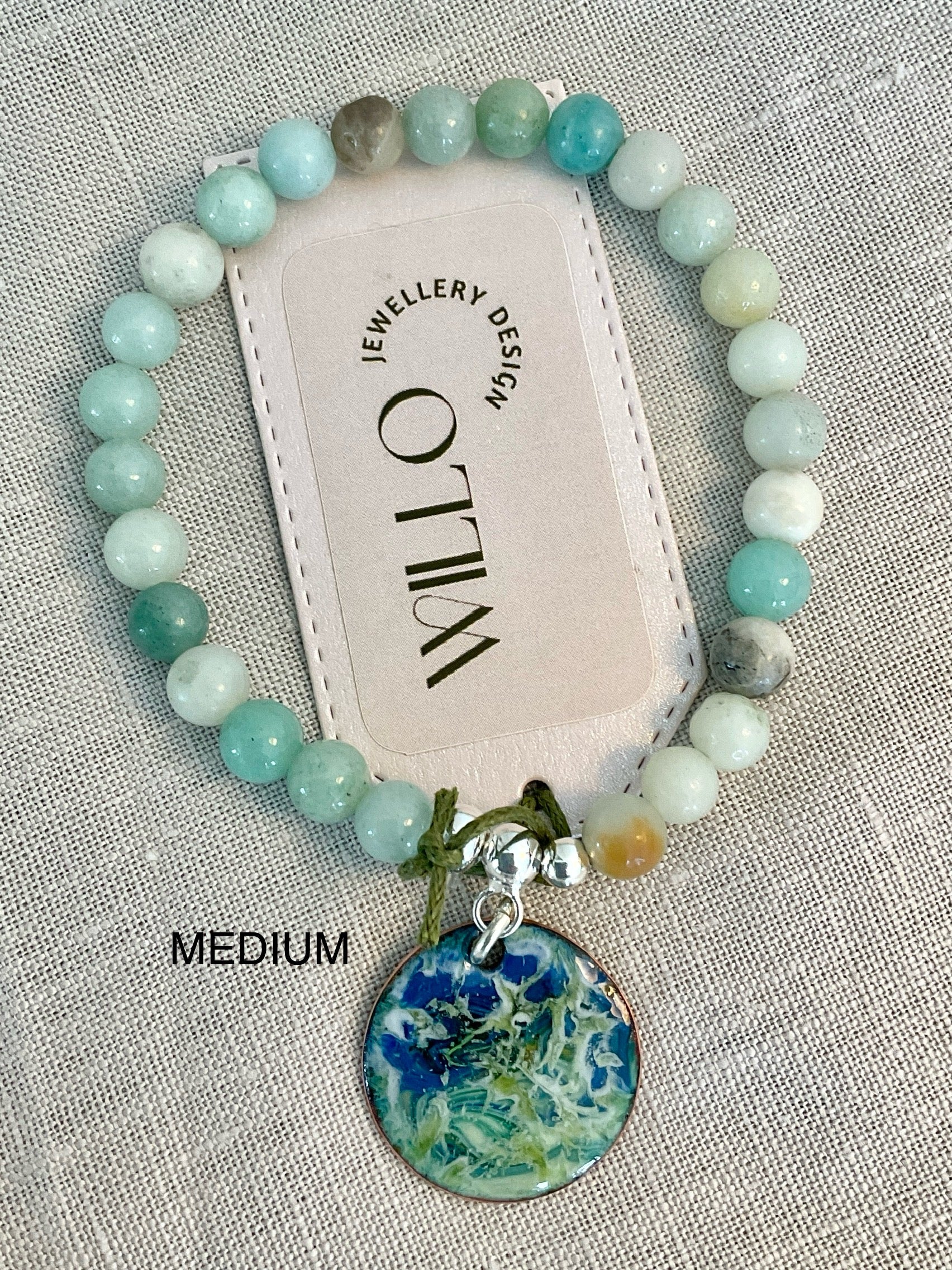 Amazonite gemstone bracelet with enamel charm.