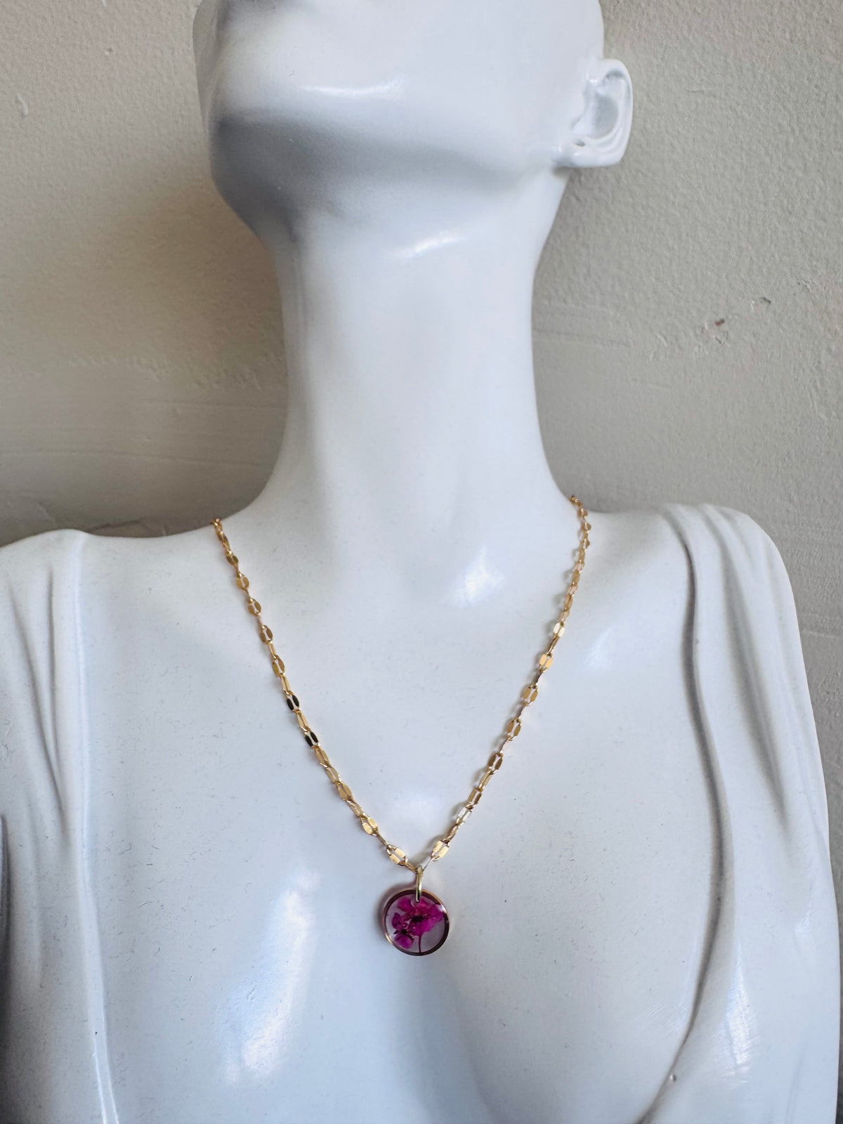 Gold plated resin necklace with fuchsia pink wildflower