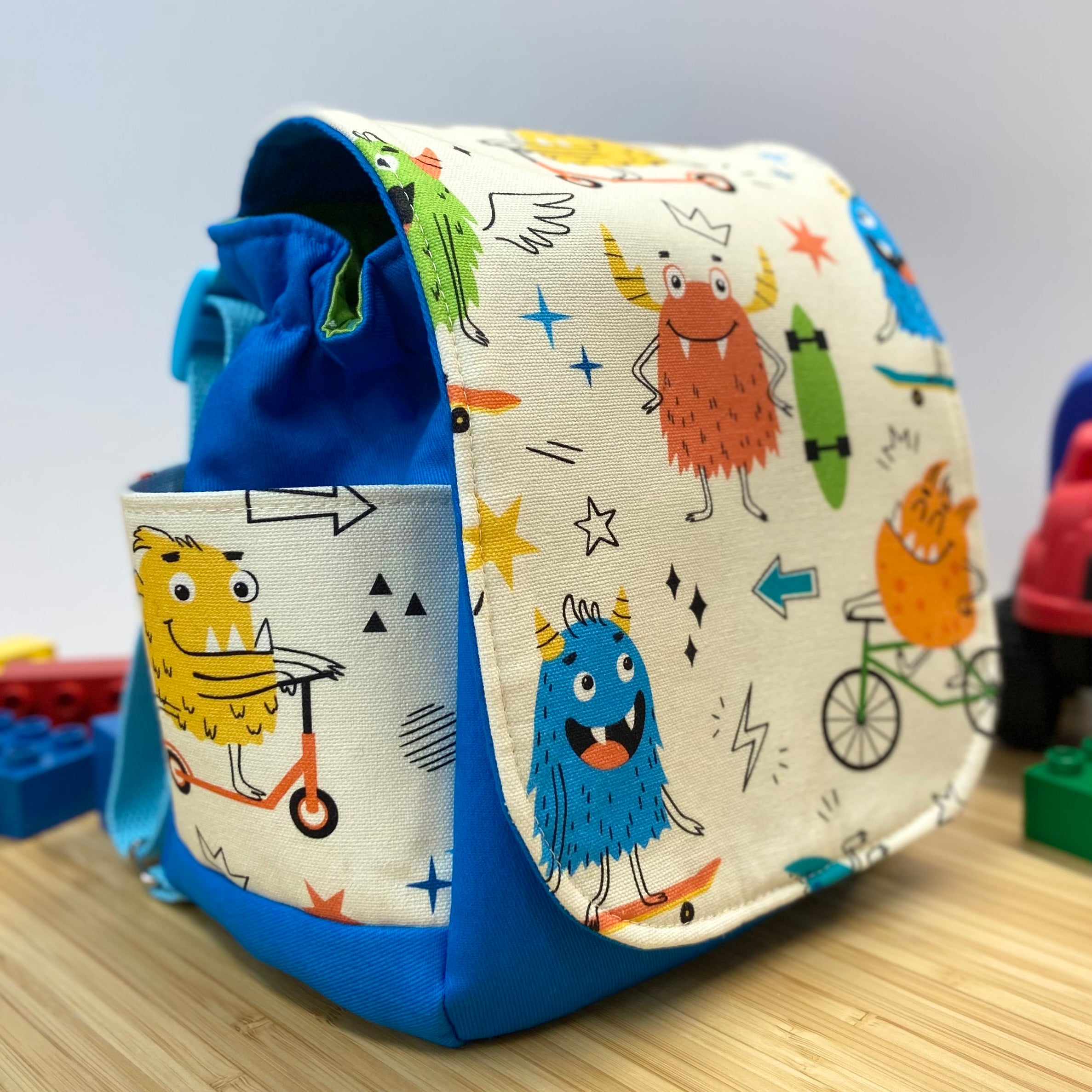 Handmade Children’s Mini Backpack - Monsters on Wheels