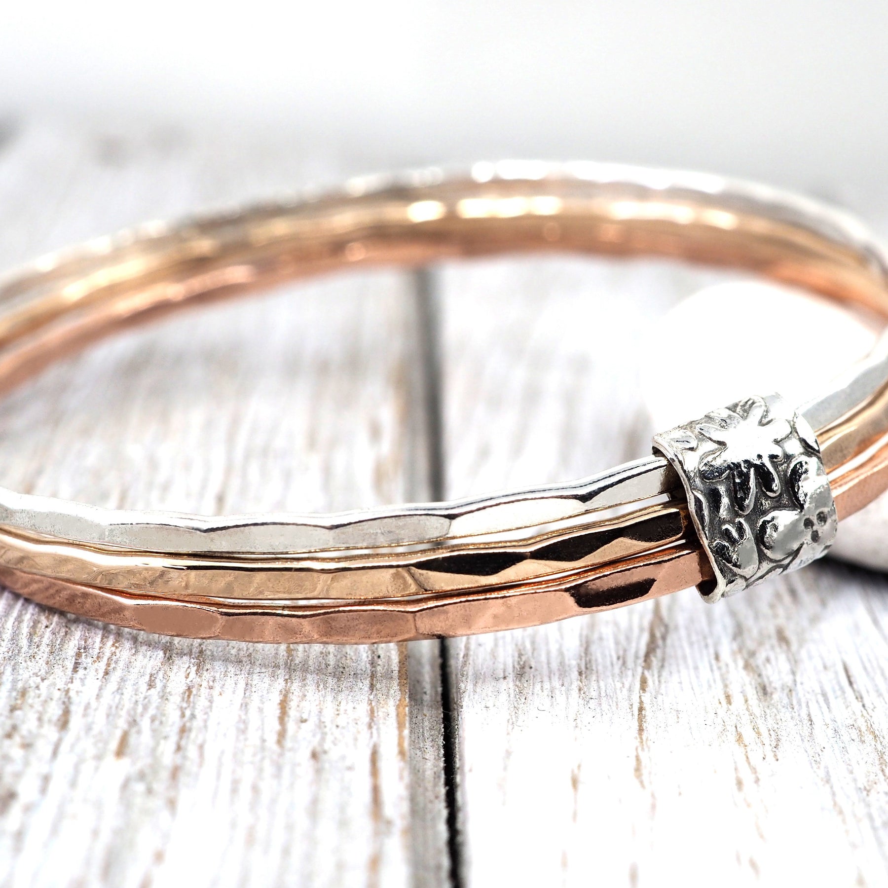 Silver, bronze and copper bangle set