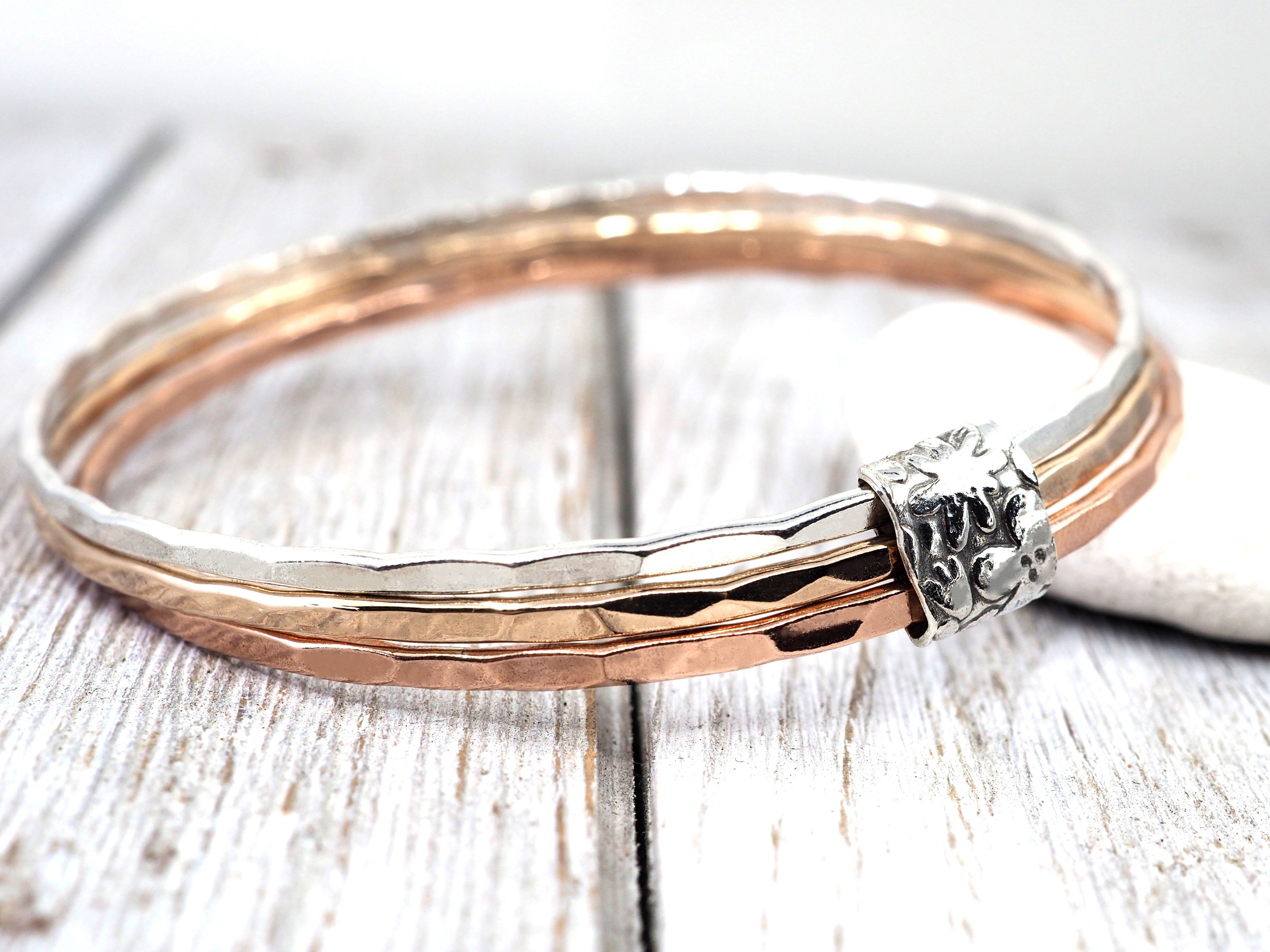 Silver, bronze and copper bangle set