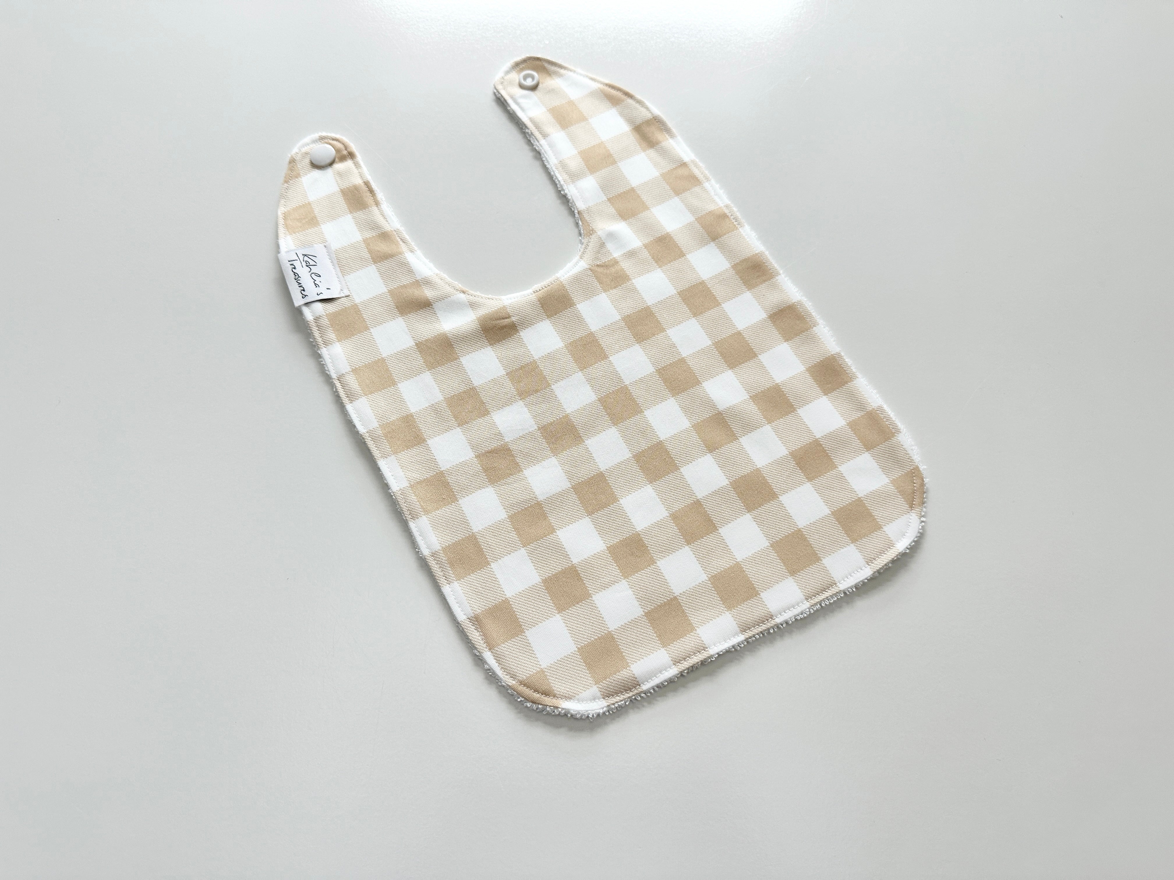 Beige gingham bib