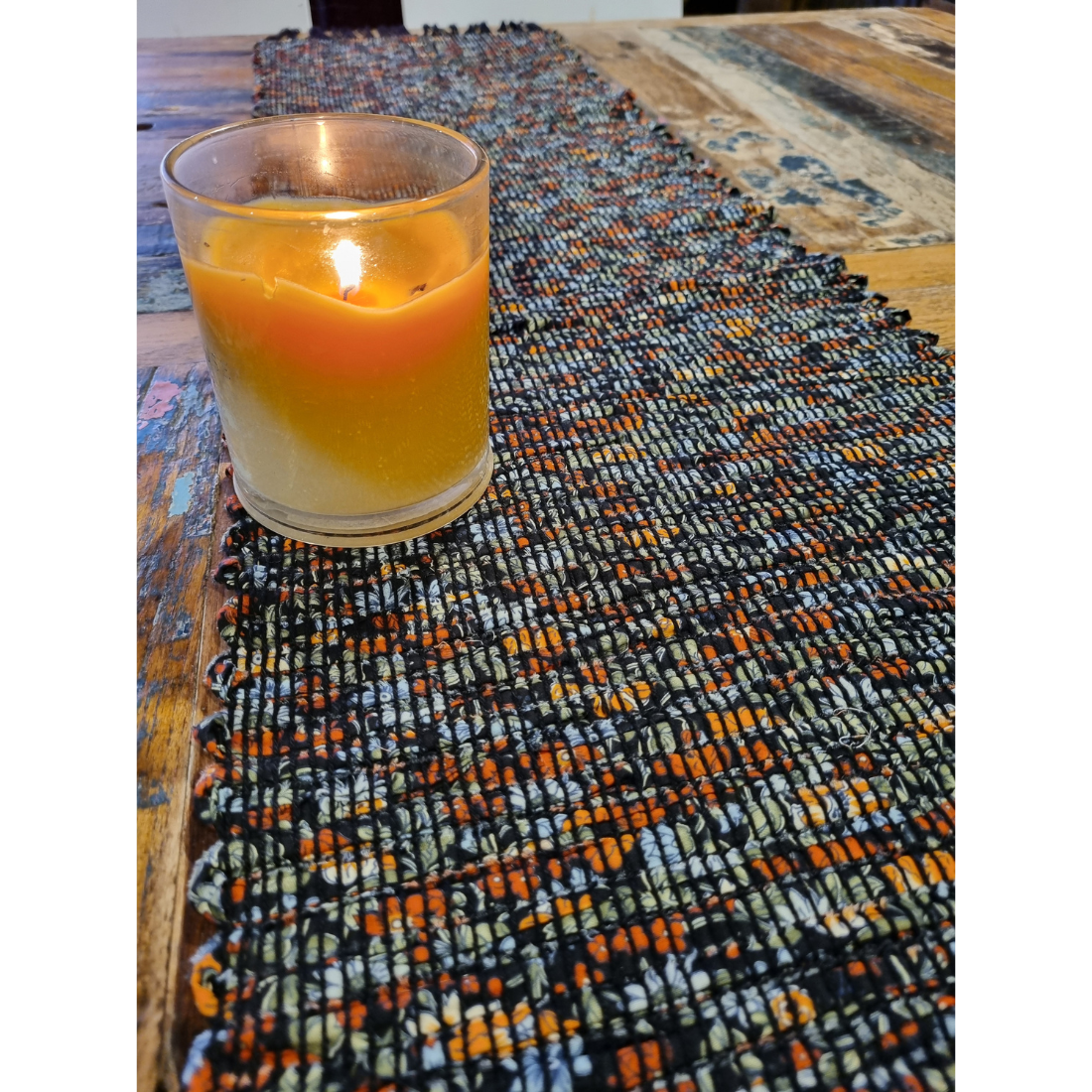 Woven black and orange floral tablerunner
