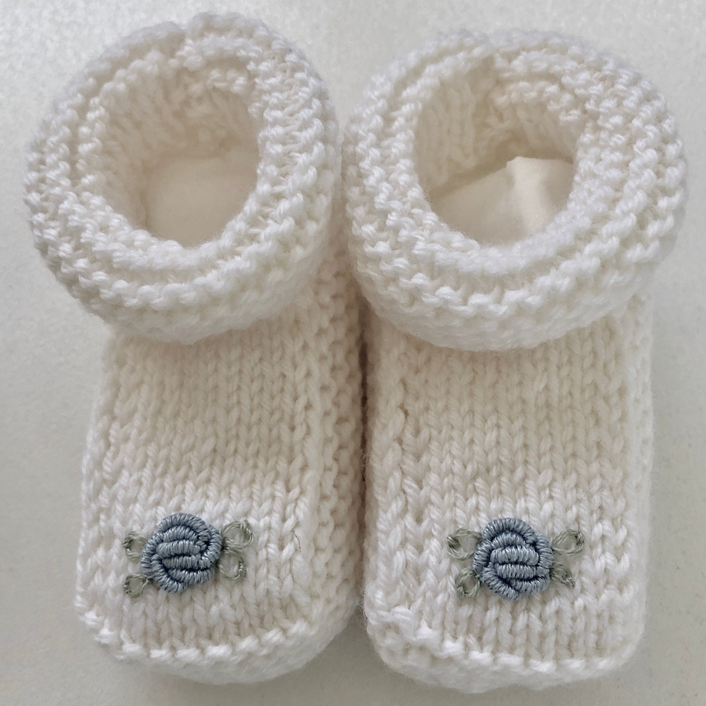 Hand-knitted baby booties with hand-embroidered rosebuds (Australian merino wool)