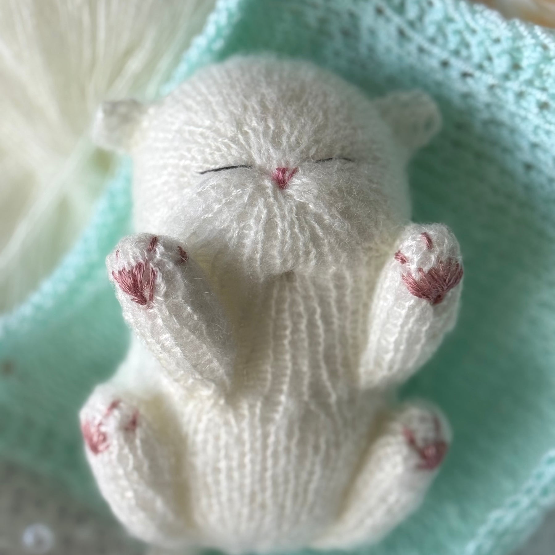 Handmade White Knitted Sleeping Kitty Toy in The Bunny Hat and Blanket