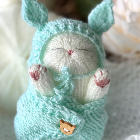 Handmade White Knitted Sleeping Kitty Toy in The Bunny Hat and Blanket