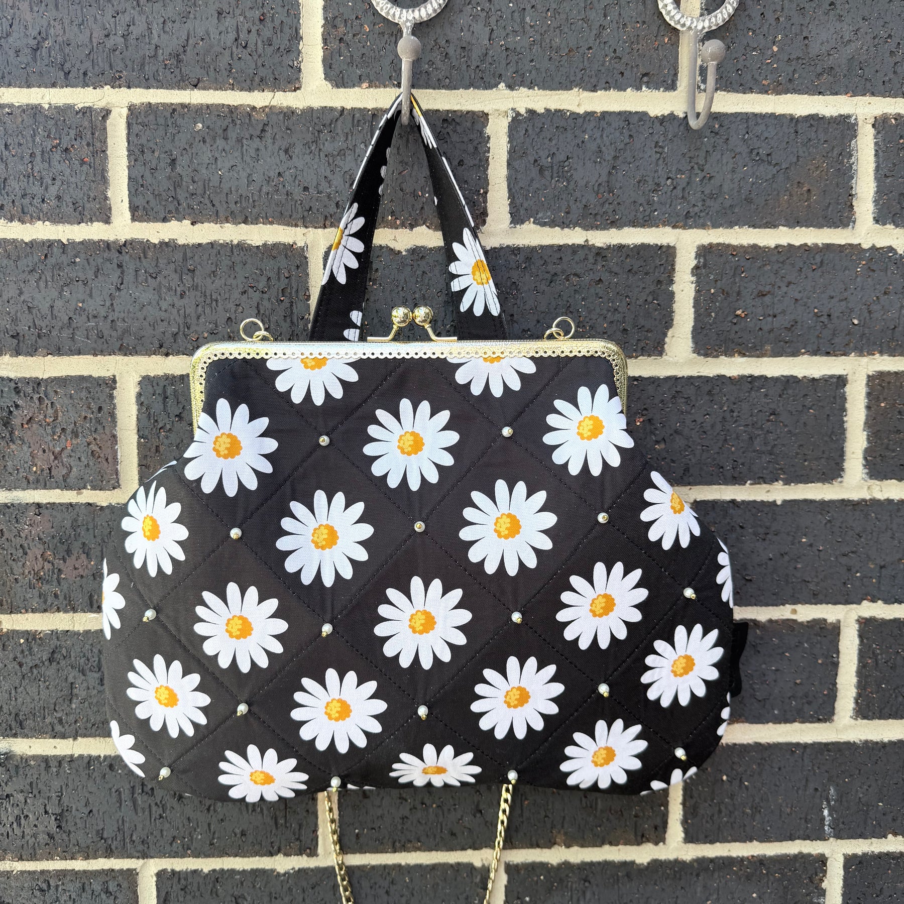 ‘Field of daisies’ metal frame purse
