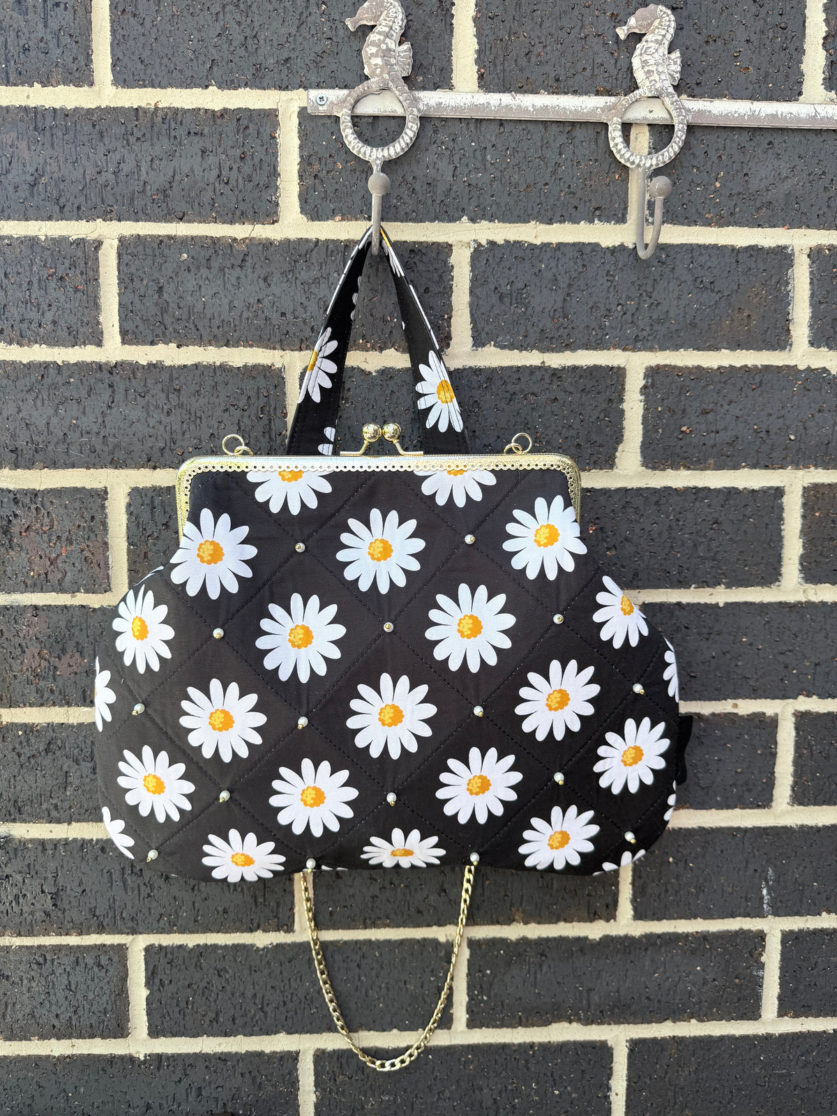 ‘Field of daisies’ metal frame purse