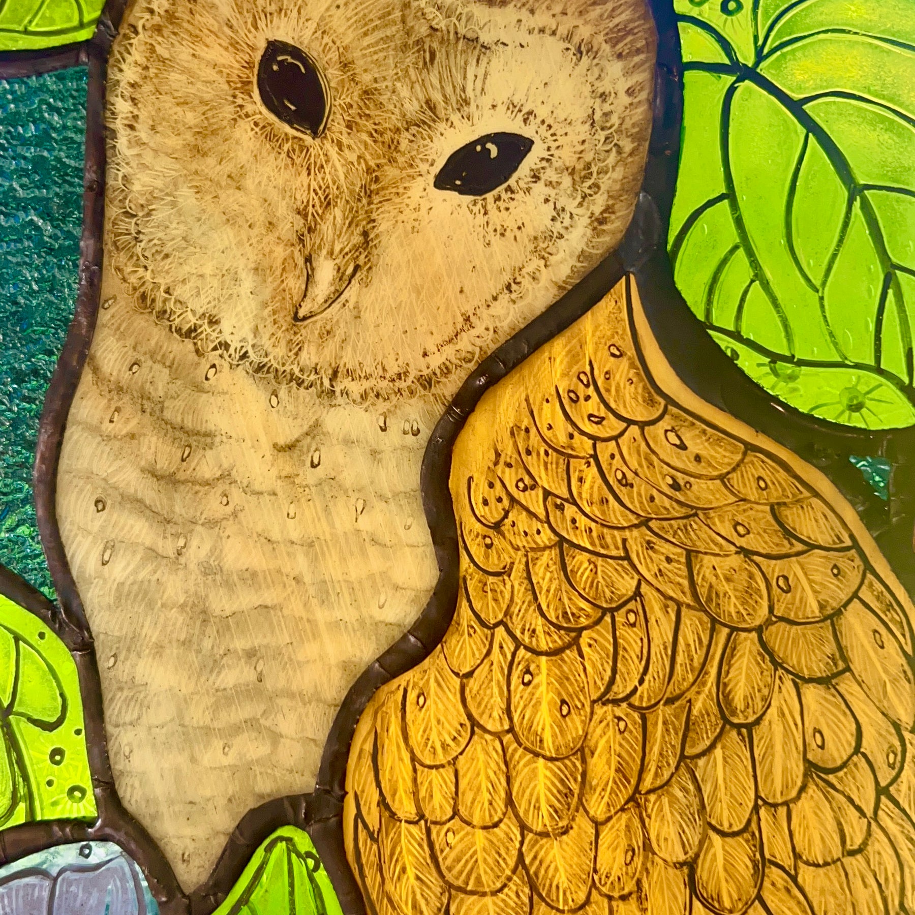 Stained glass owl panel.
