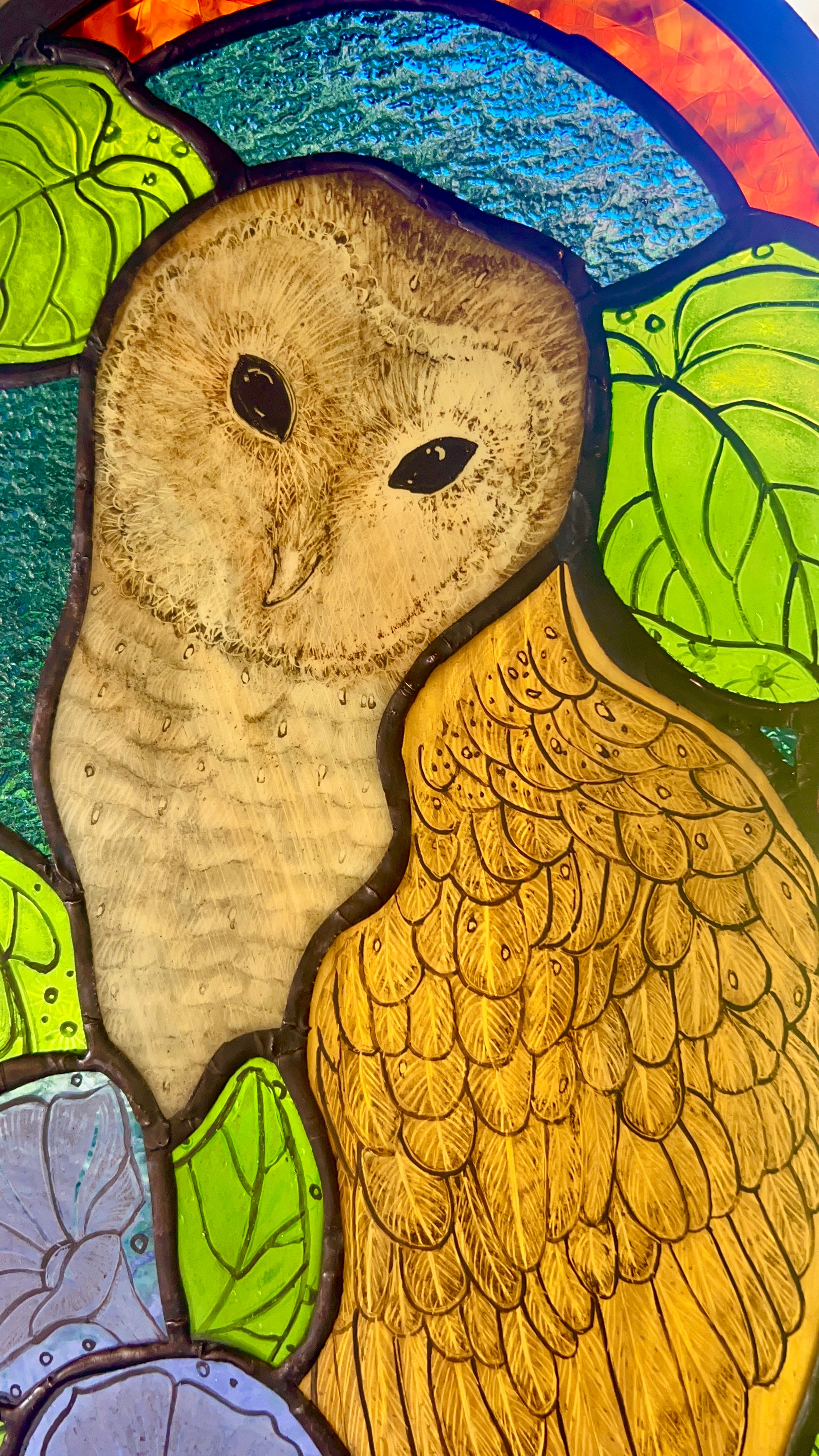 Stained glass owl panel.