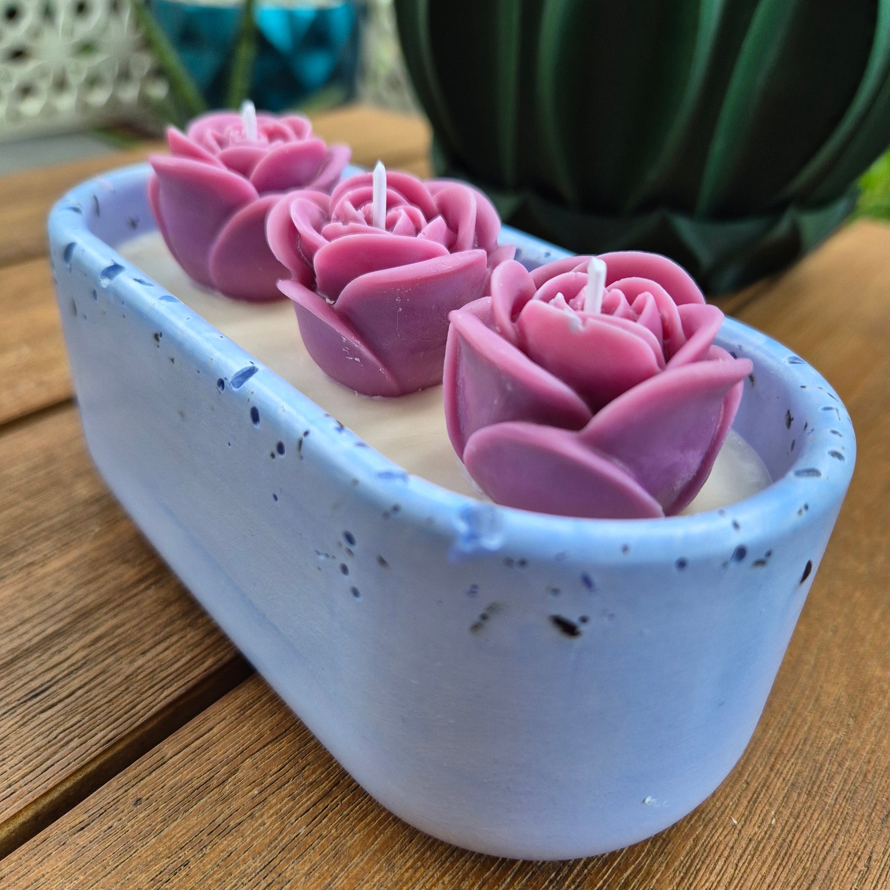 Pale blue concrete bowl candle with quartz stones and roses