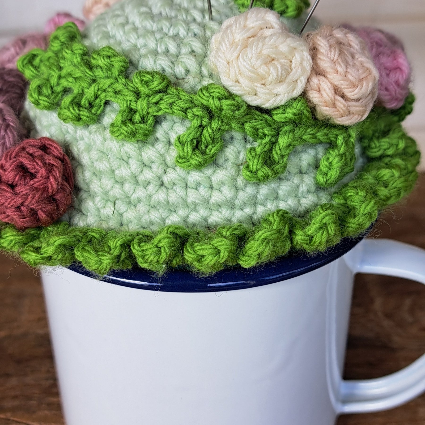 Pin cushion with pretty roses in a sturdy enamel tin mug