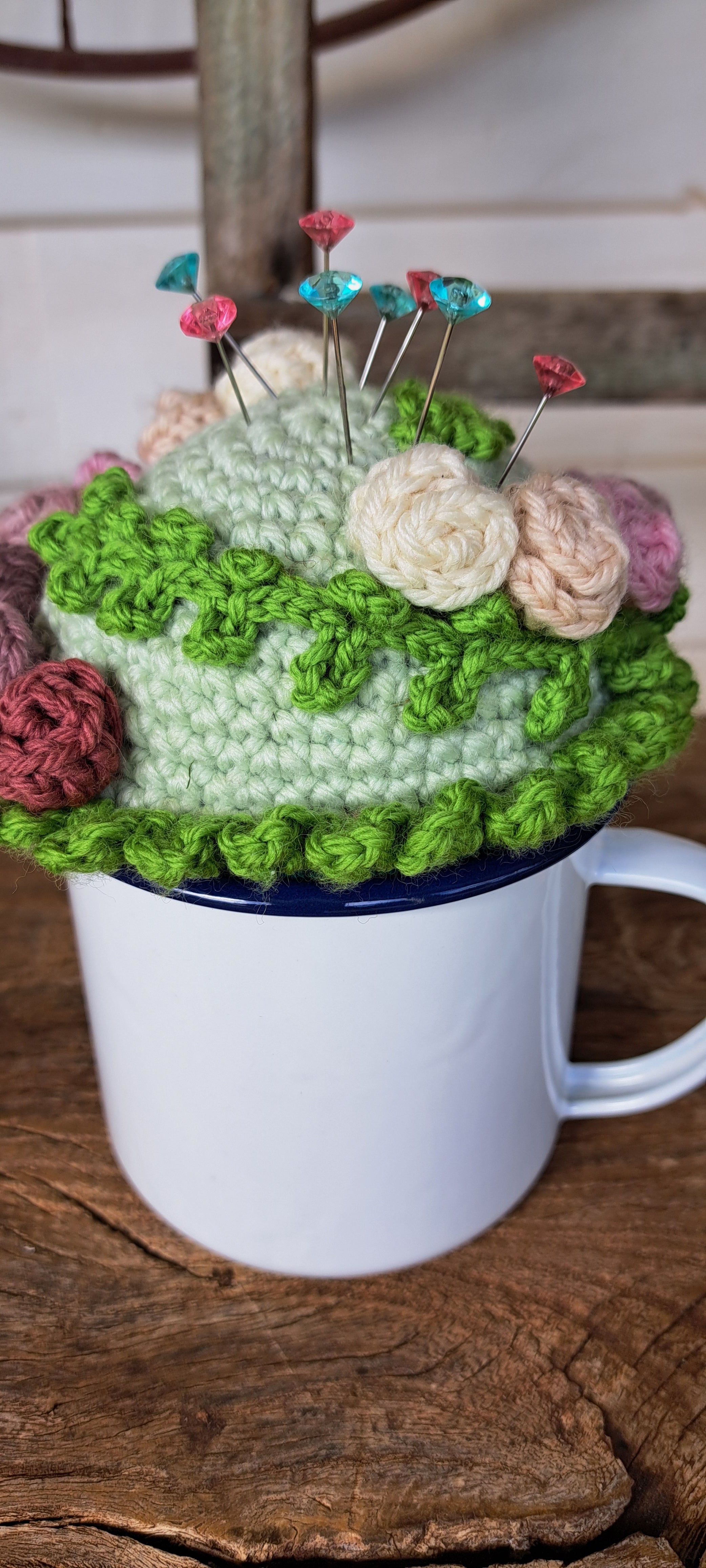 Pin cushion with pretty roses in a sturdy enamel tin mug