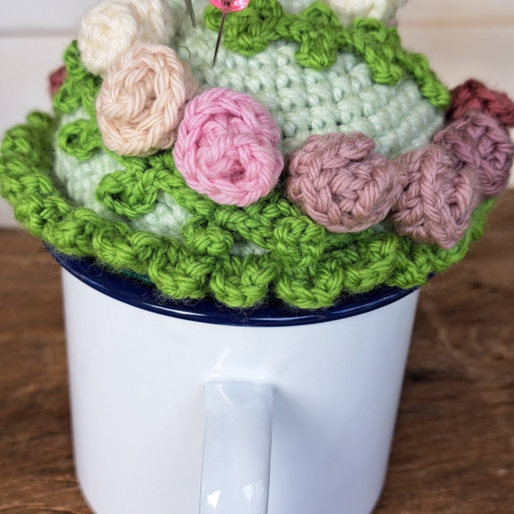 Pin cushion with pretty roses in a sturdy enamel tin mug