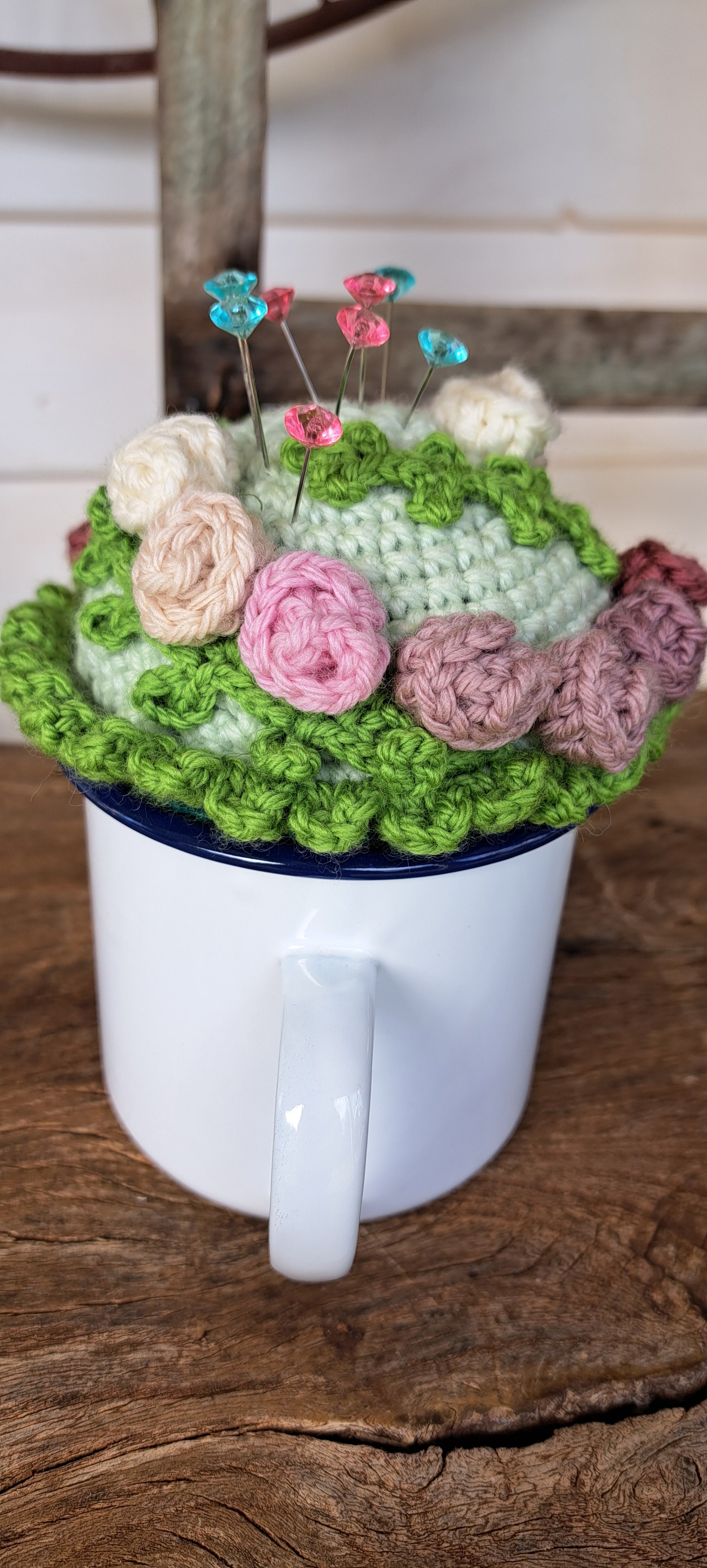 Pin cushion with pretty roses in a sturdy enamel tin mug