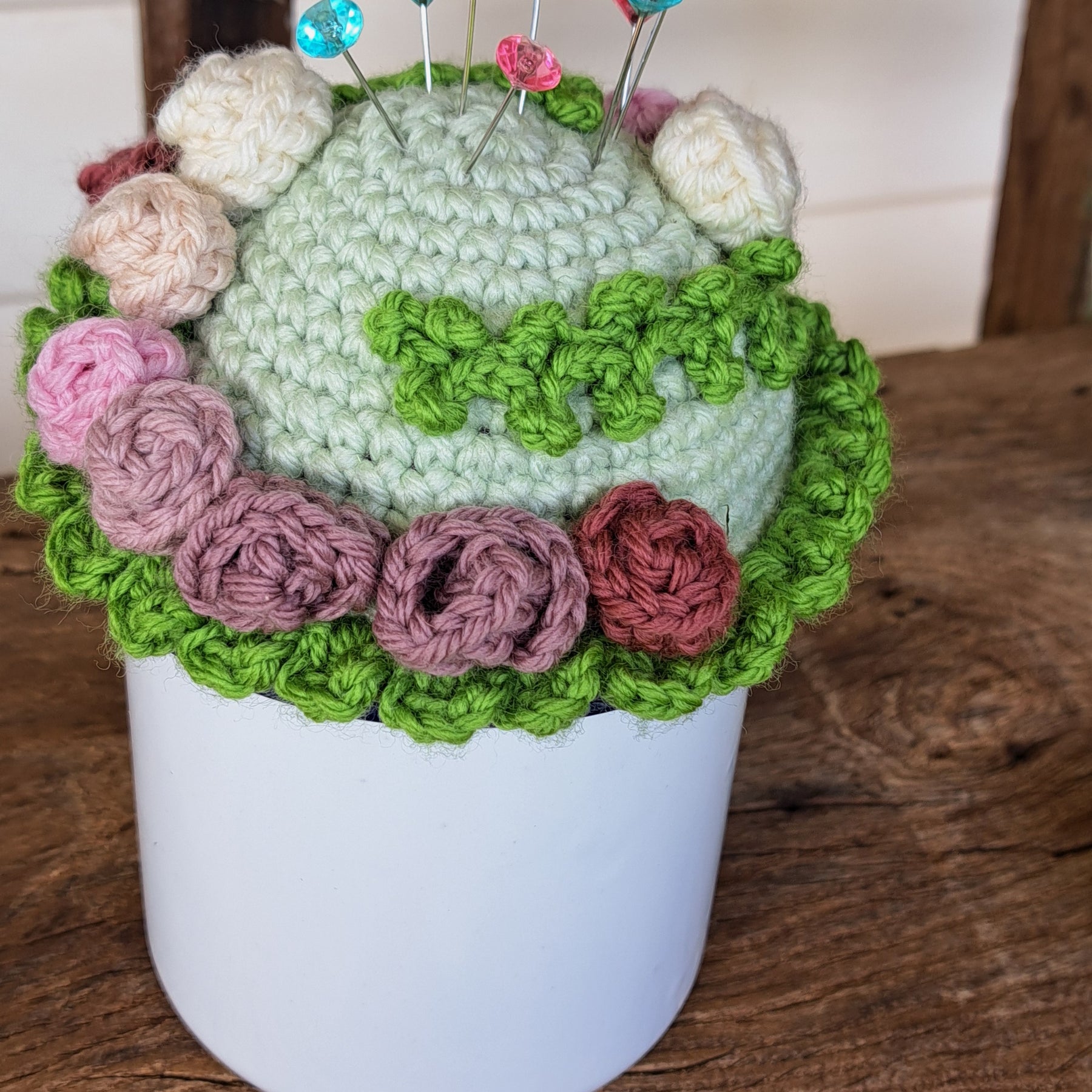 Pin cushion with pretty roses in a sturdy enamel tin mug