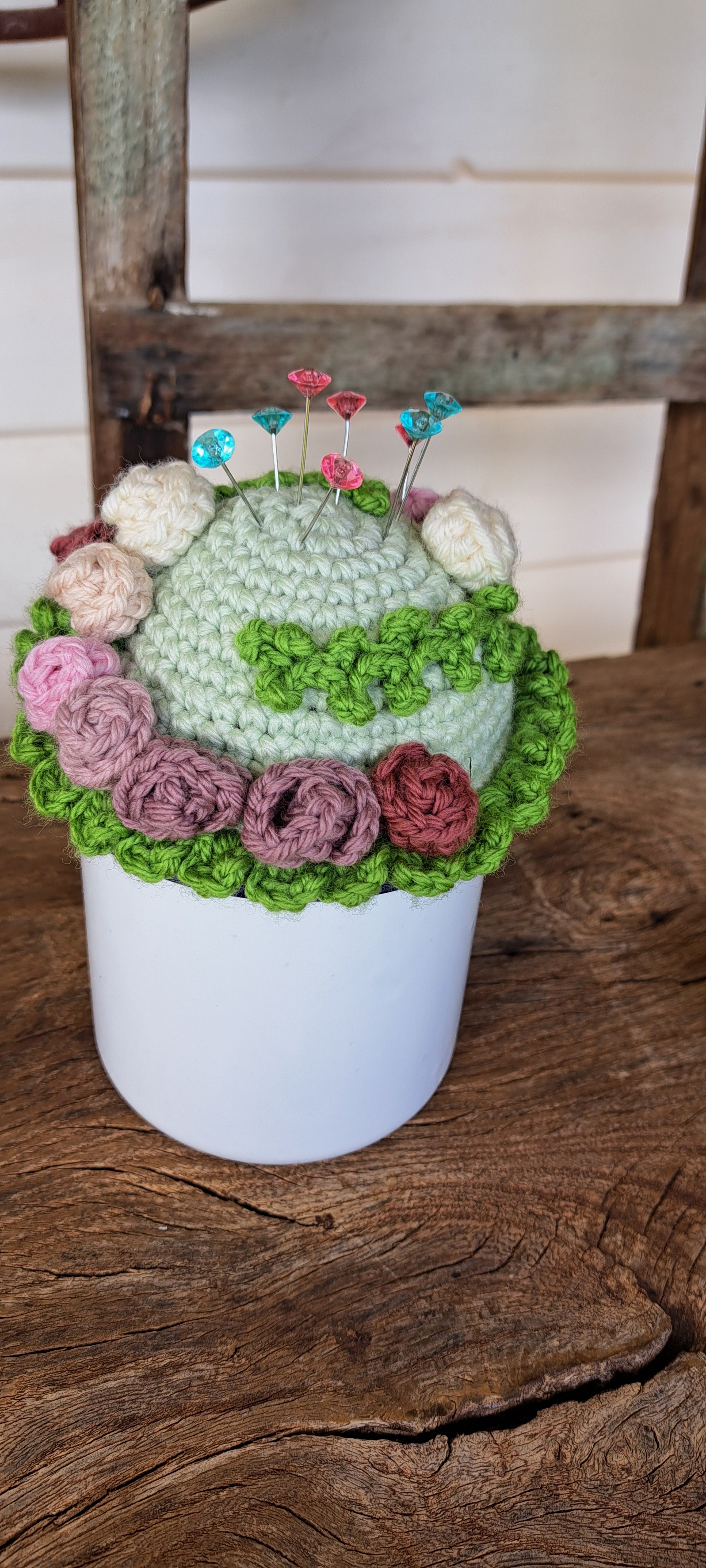 Pin cushion with pretty roses in a sturdy enamel tin mug