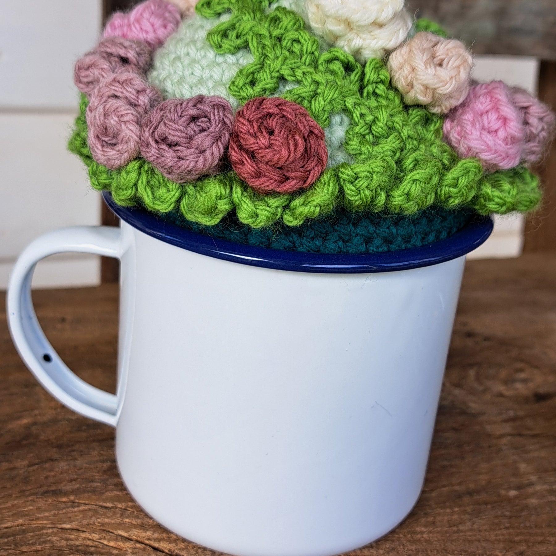 Pin cushion with pretty roses in a sturdy enamel tin mug