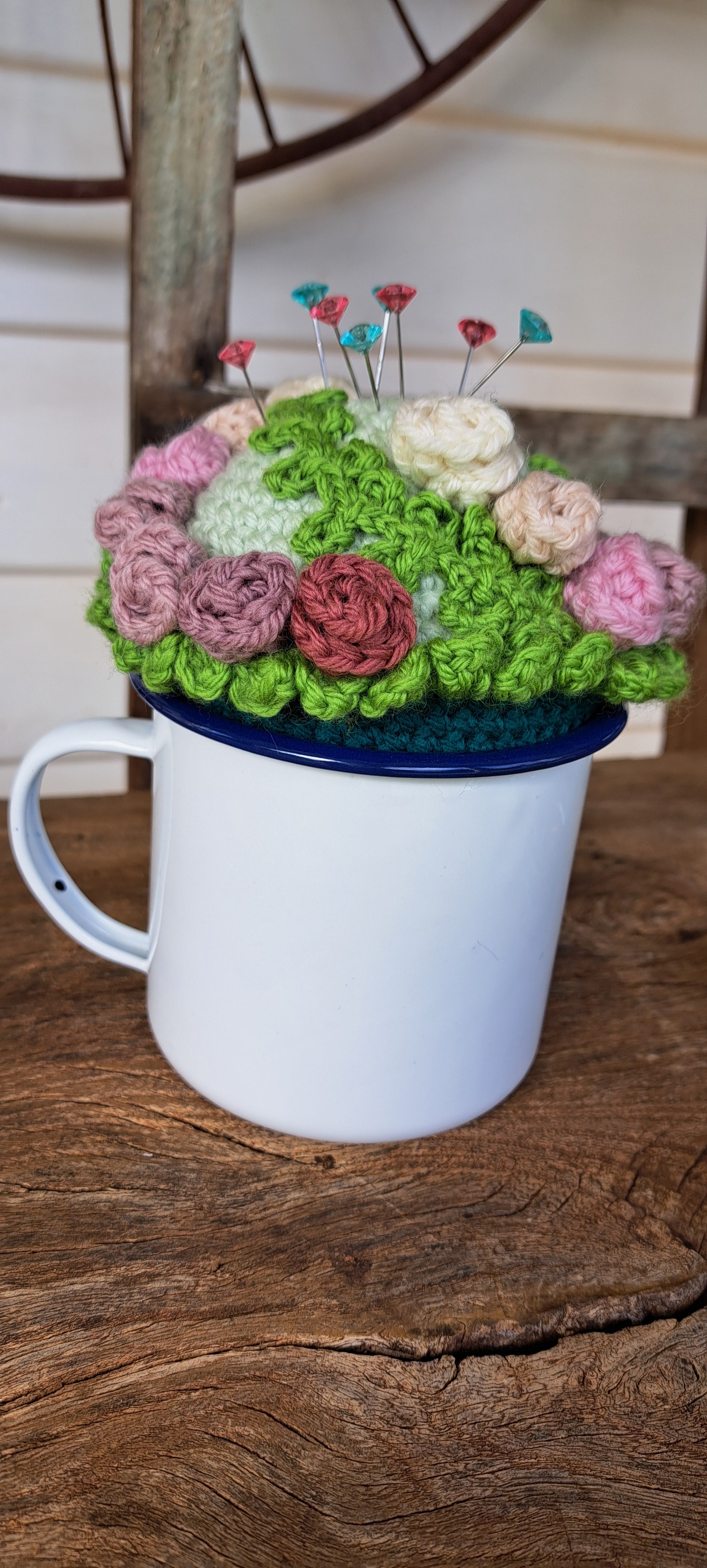 Pin cushion with pretty roses in a sturdy enamel tin mug