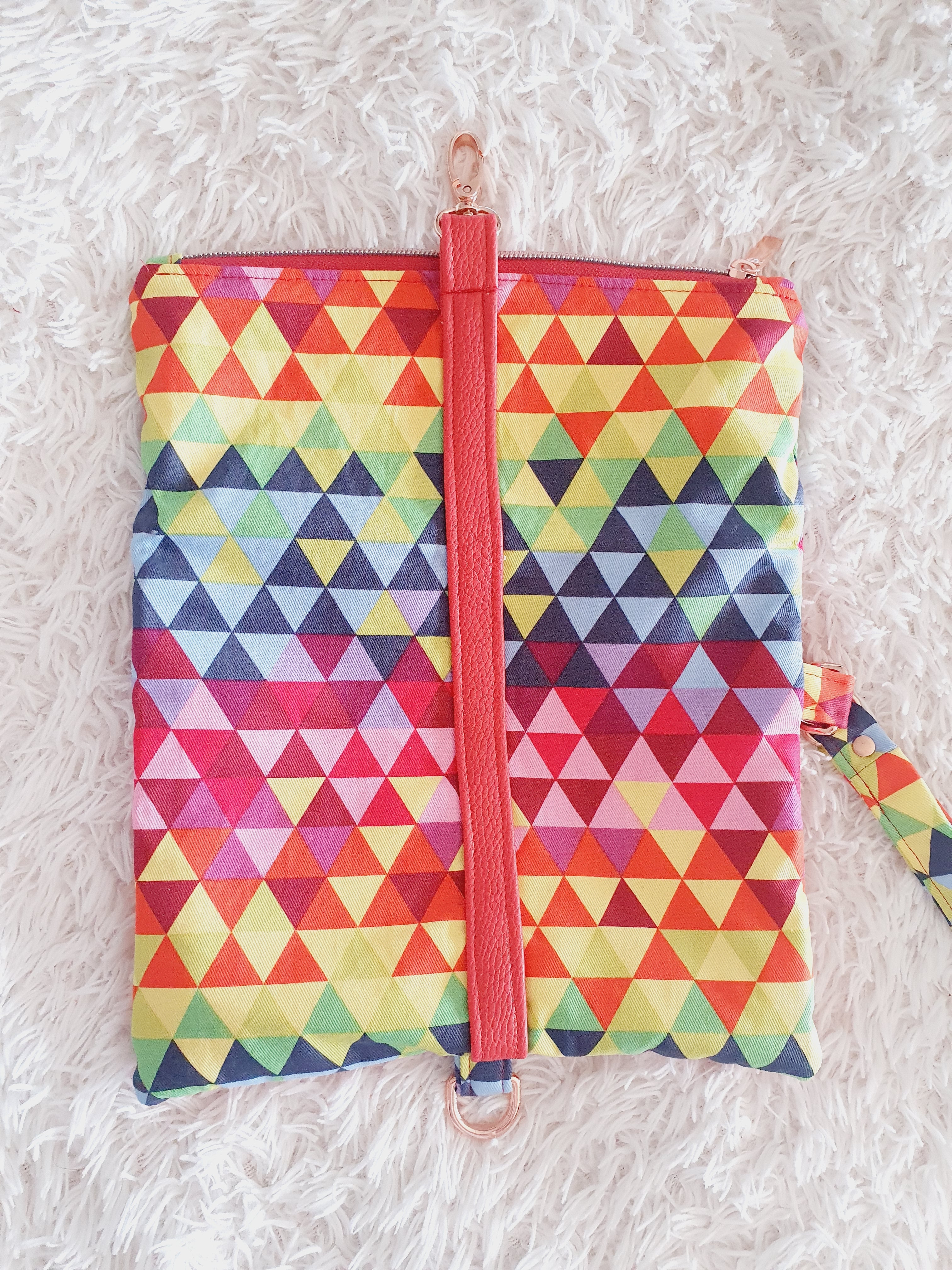 Multi colored red modern fold over zipper clutch with detachable strap