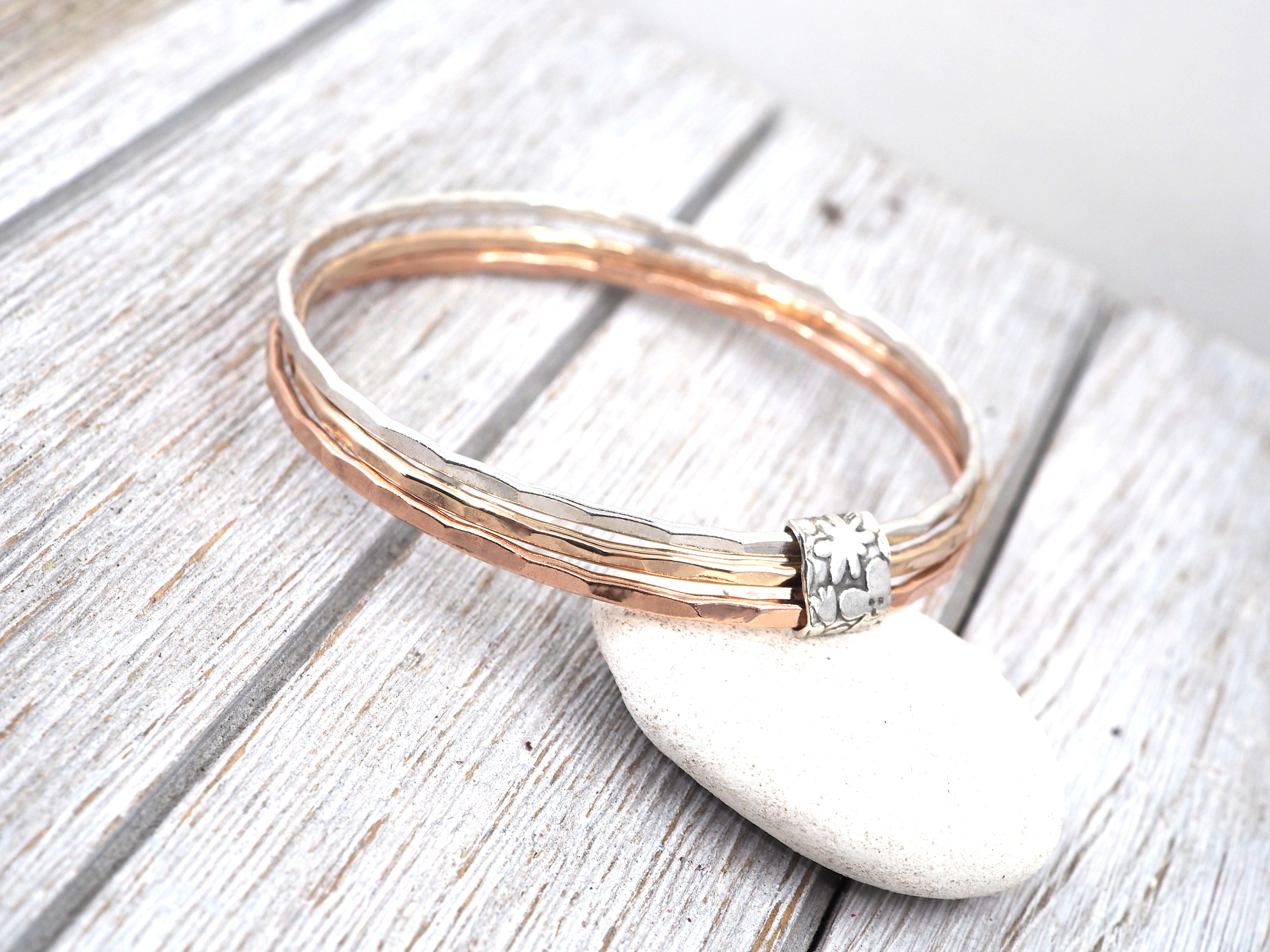 Silver, bronze and copper bangle set